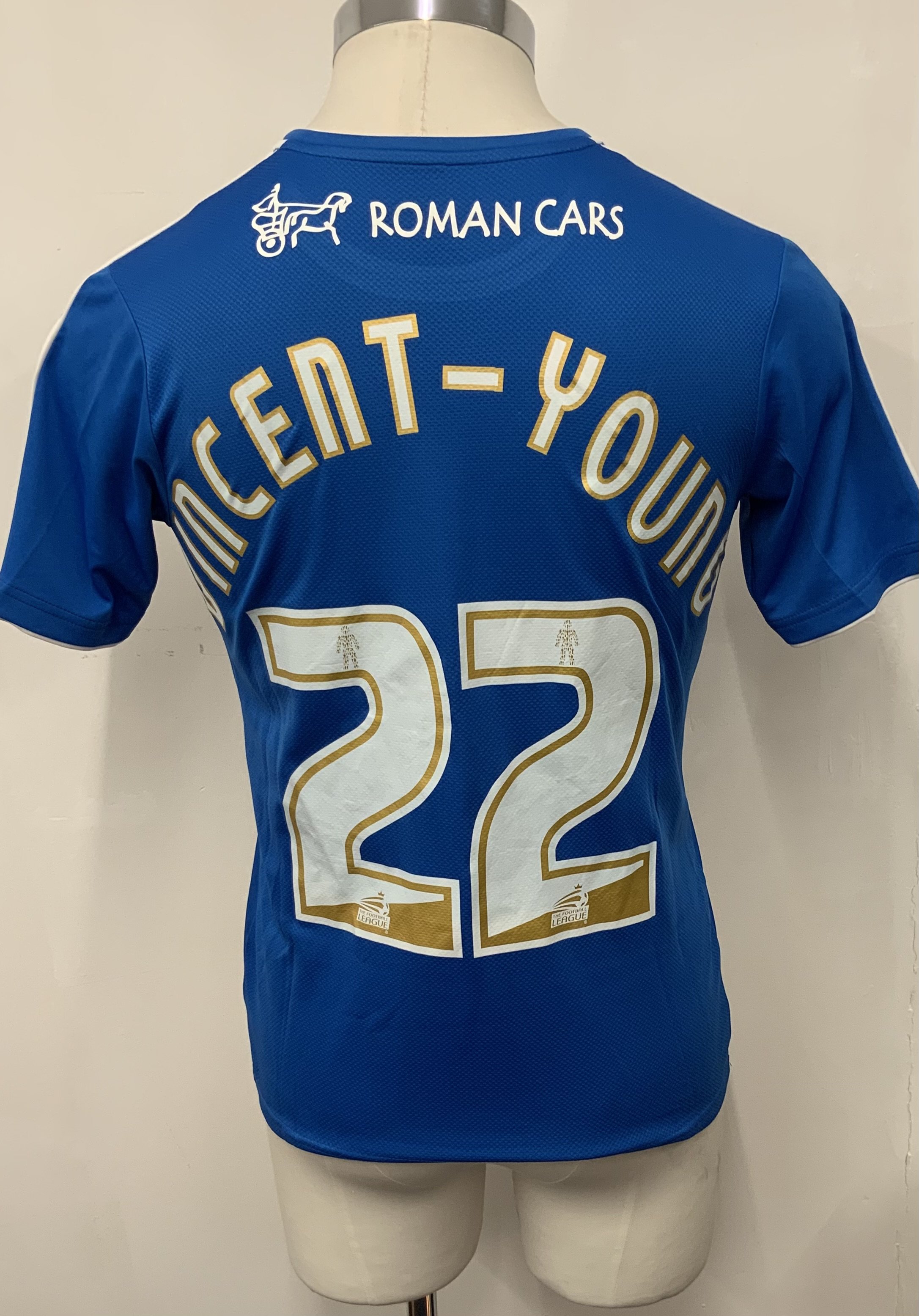 Colchester United 2015 - 2016 Match Worn Football Shirt: Blue and white short sleeve shirt with FA Cup badging to sleeves. Vincent-Young 22 to rear. Worn v Tottenham on 30 January 2016. Played the full 90 minutes. 