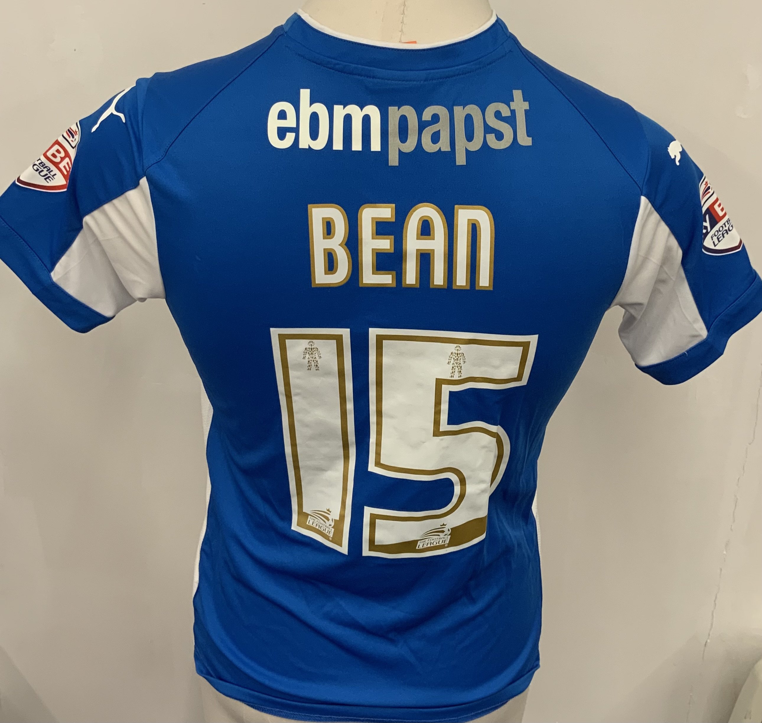 Colchester United 2014 - 2015 Match Worn Football Shirt: Blue and white short sleeve shirt with Sky Bet badging to sleeves. Bean 15 to rear.