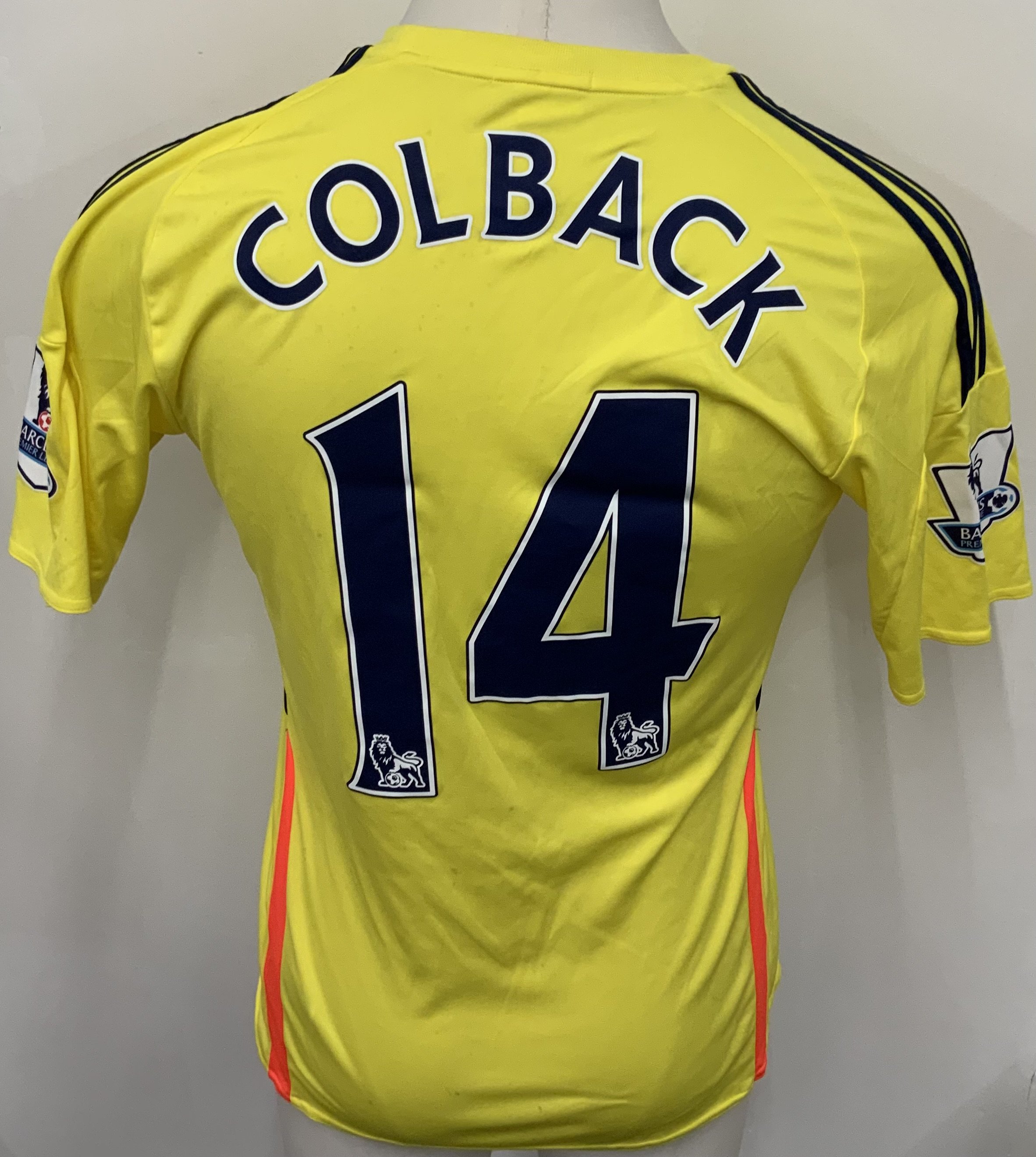 Sunderland 2013 - 2014 Match Worn Football Shirt: Yellow short sleeve shirt with Premier League badging to sleeves. Colback 14 to rear. Shirt is unwashed. 