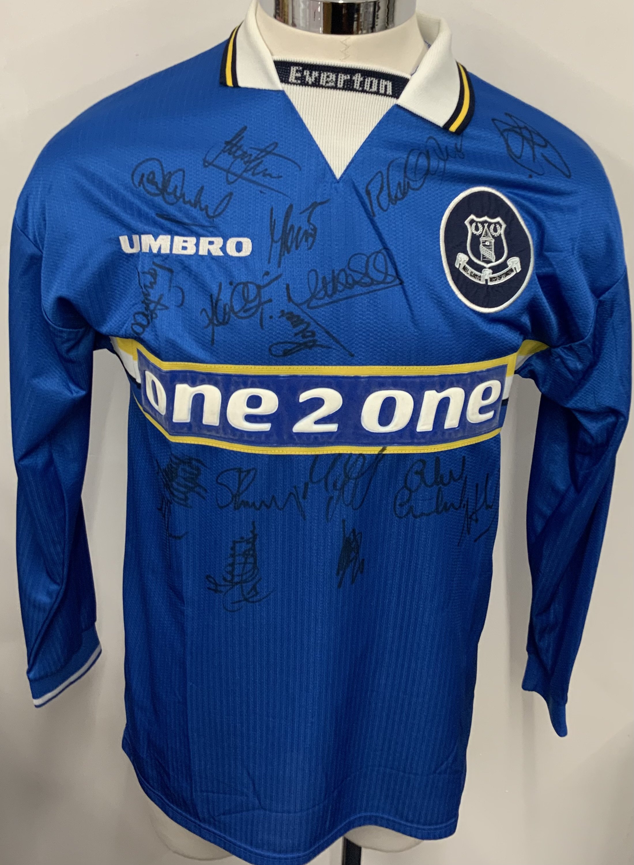 Everton 1997 - 1999 Match Worn Football Shirt: Blue long sleeve shirt with Premier League badging to sleeves. Oster 19 to rear. Shirt has been signed by the squad. 