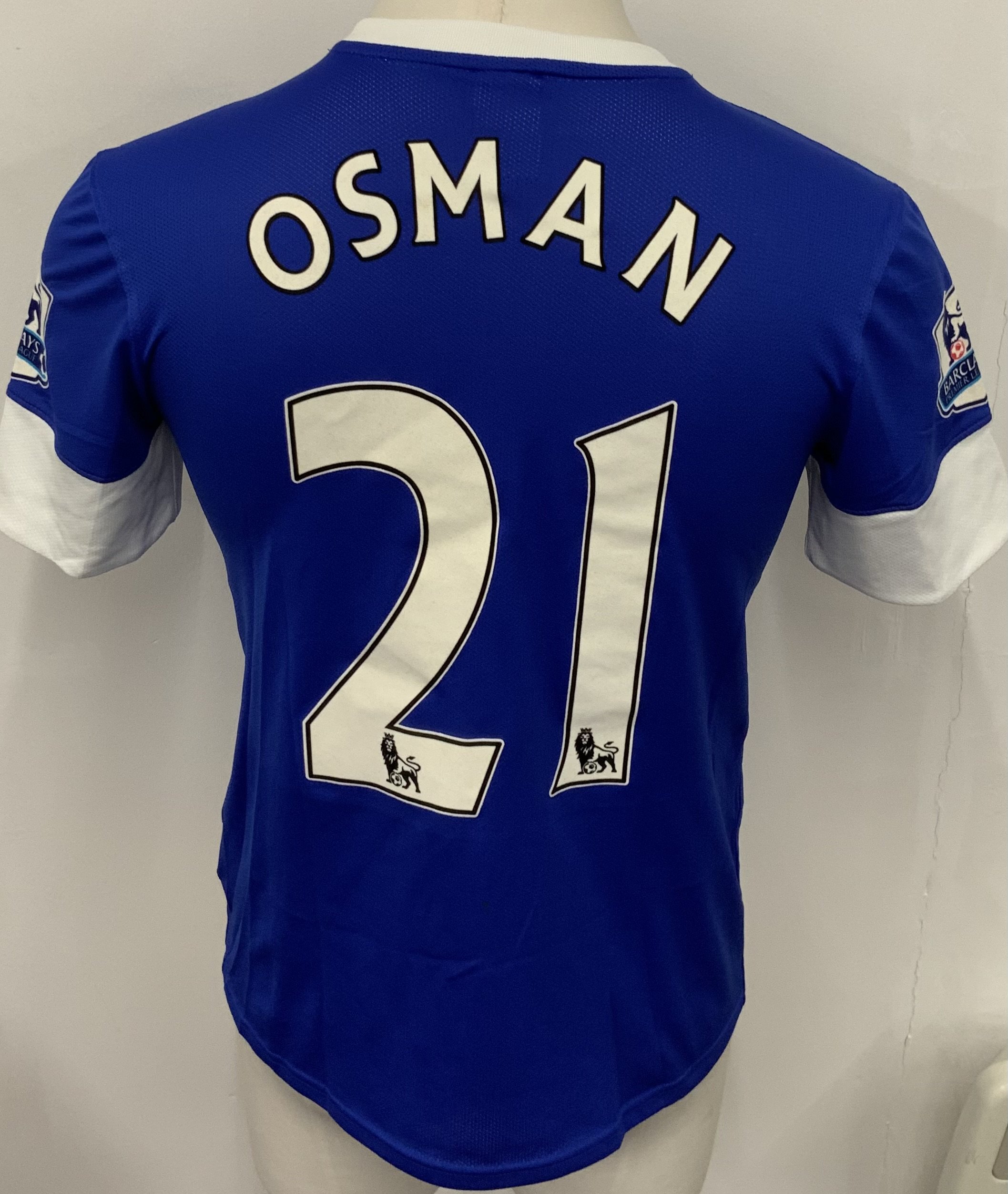 Everton 2012 - 2013 Match Worn Football Shirt: Blue short sleeve shirt with Premier League badging to sleeves. Osman 21 to rear. 