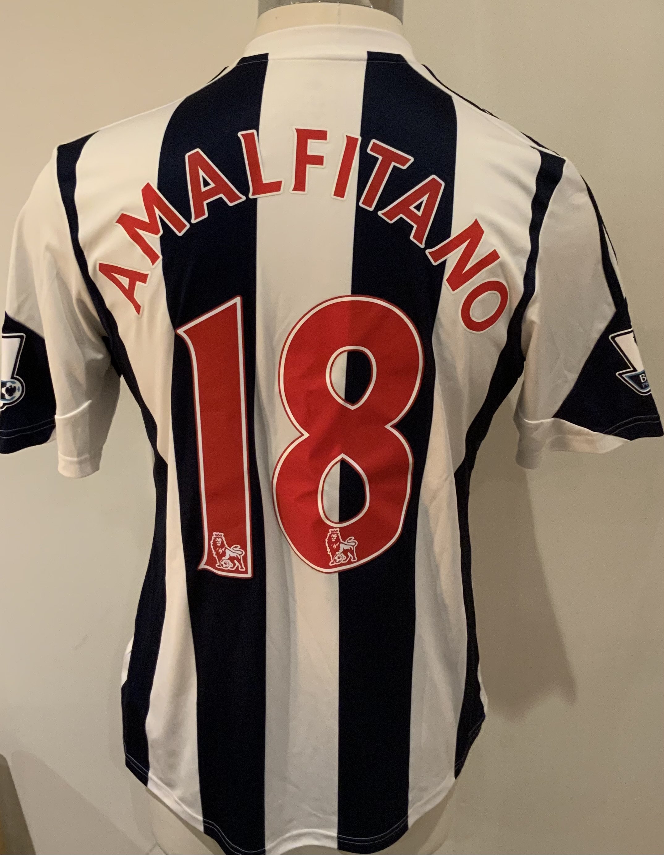 West Brom 2013 - 2014 Match Worn Football Shirt: Blue and white short sleeve shirt with Premier League badges to sleeves. Amalfitano 18 to rear. Worn v Arsenal on 6 October 2013.