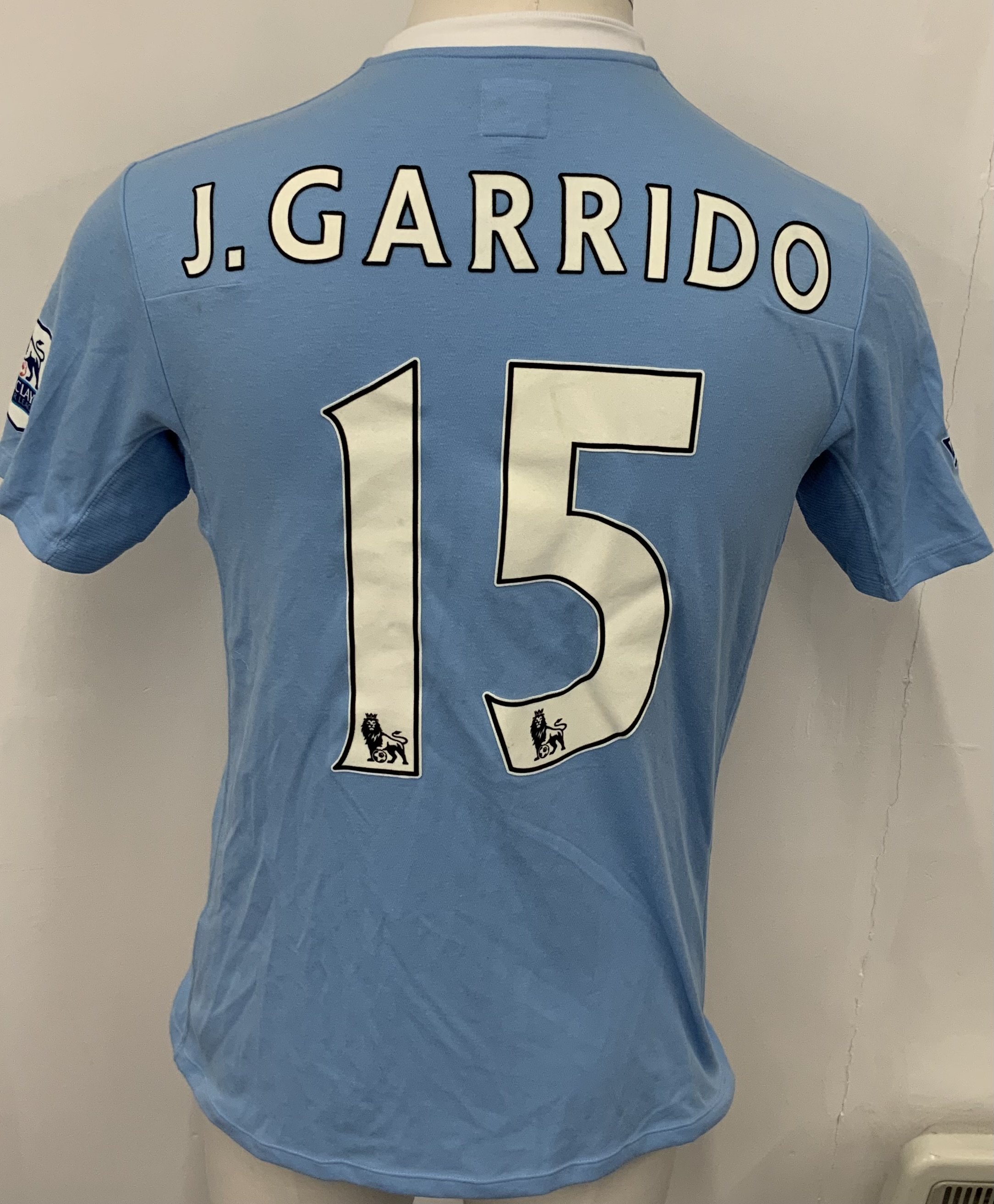 Manchester City 2009 - 2010 Garrido Match Worn Football Shirt: Blue short sleeve Umbro shirt from 1st season of Etihad Sponsorship. Premier League badging to sleeve and J Garrido 15 to rear. 