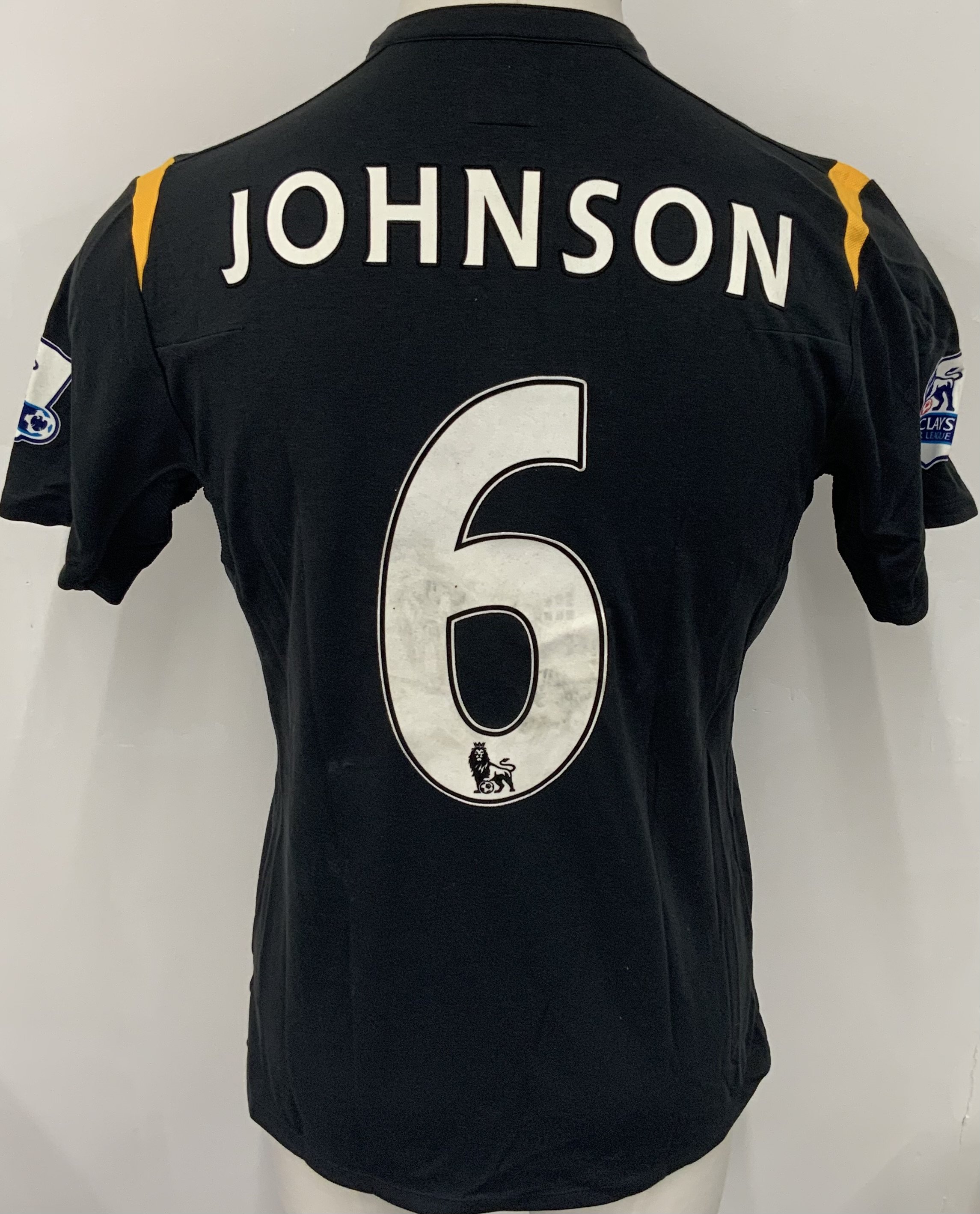 Manchester City 2009 - 2010 M Johnson Match Issued Football Shirt: Black short sleeve Umbro shirt from 1st season of Etihad Sponsorship. Premier League badging to sleeve and Johnson 6 to rear. 