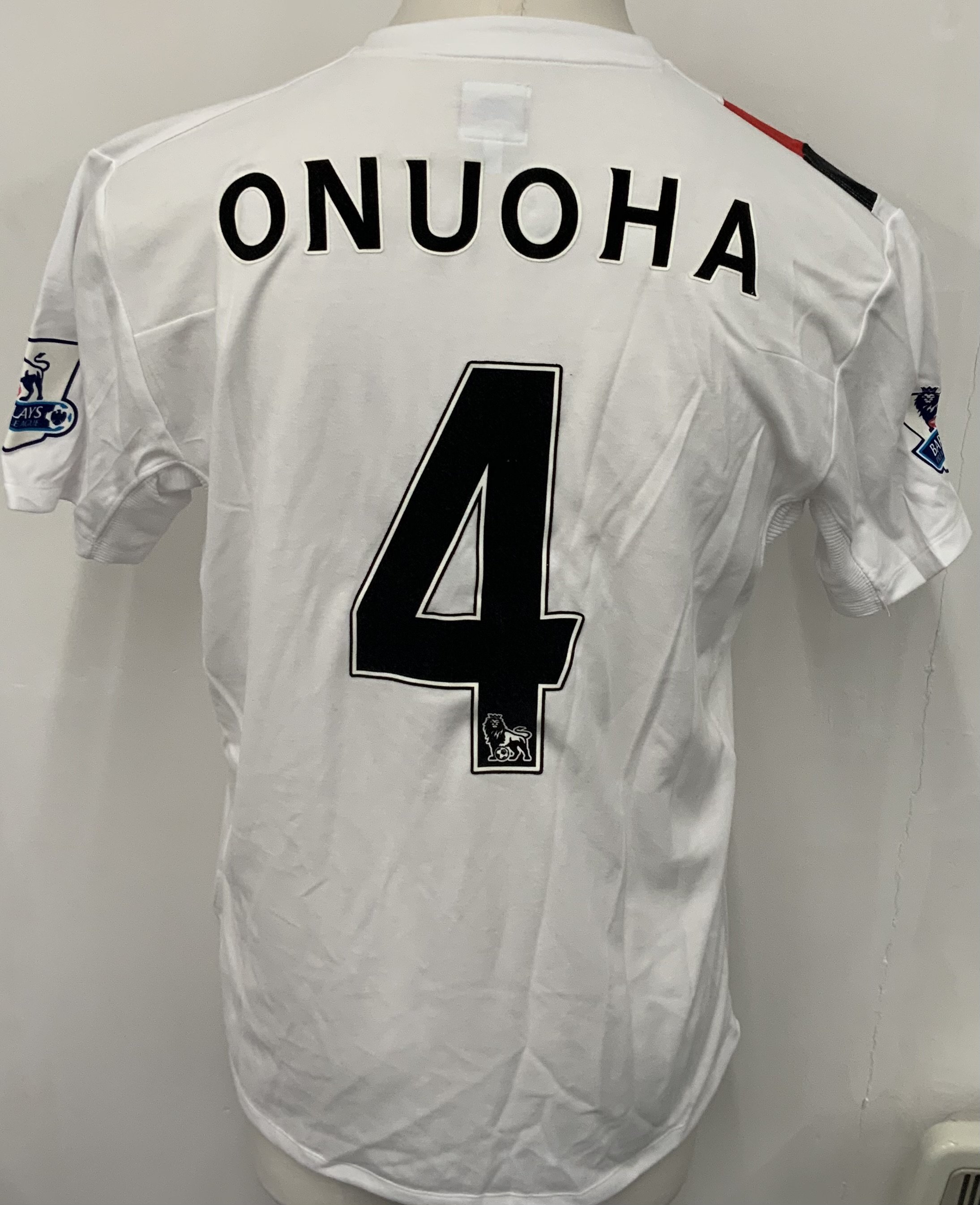 Manchester City 2009 - 2010 Onuoha 3rd Kit Match Issued Football Shirt: White with red and black slash short sleeve Umbro shirt from 1st season of Etihad Sponsorship. Premier League badging to sleeve and Onuoha 4 to rear. 