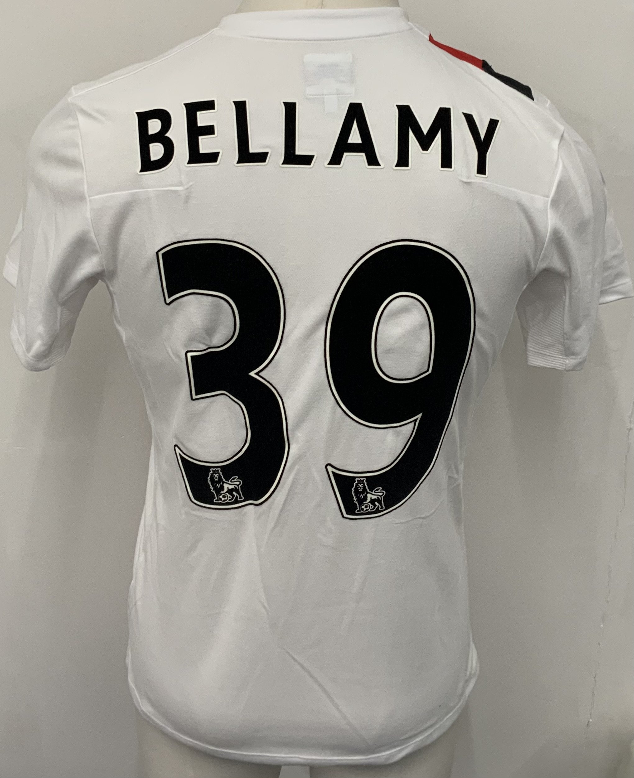 Manchester City 2009 - 2010 Bellamy 3rd Kit Match Issued Football Shirt: White with red and black slash short sleeve Umbro shirt from 1st season of Etihad Sponsorship. No badging to sleeves and Bellamy 39 to rear. Possibly issued/worn in a friendly.