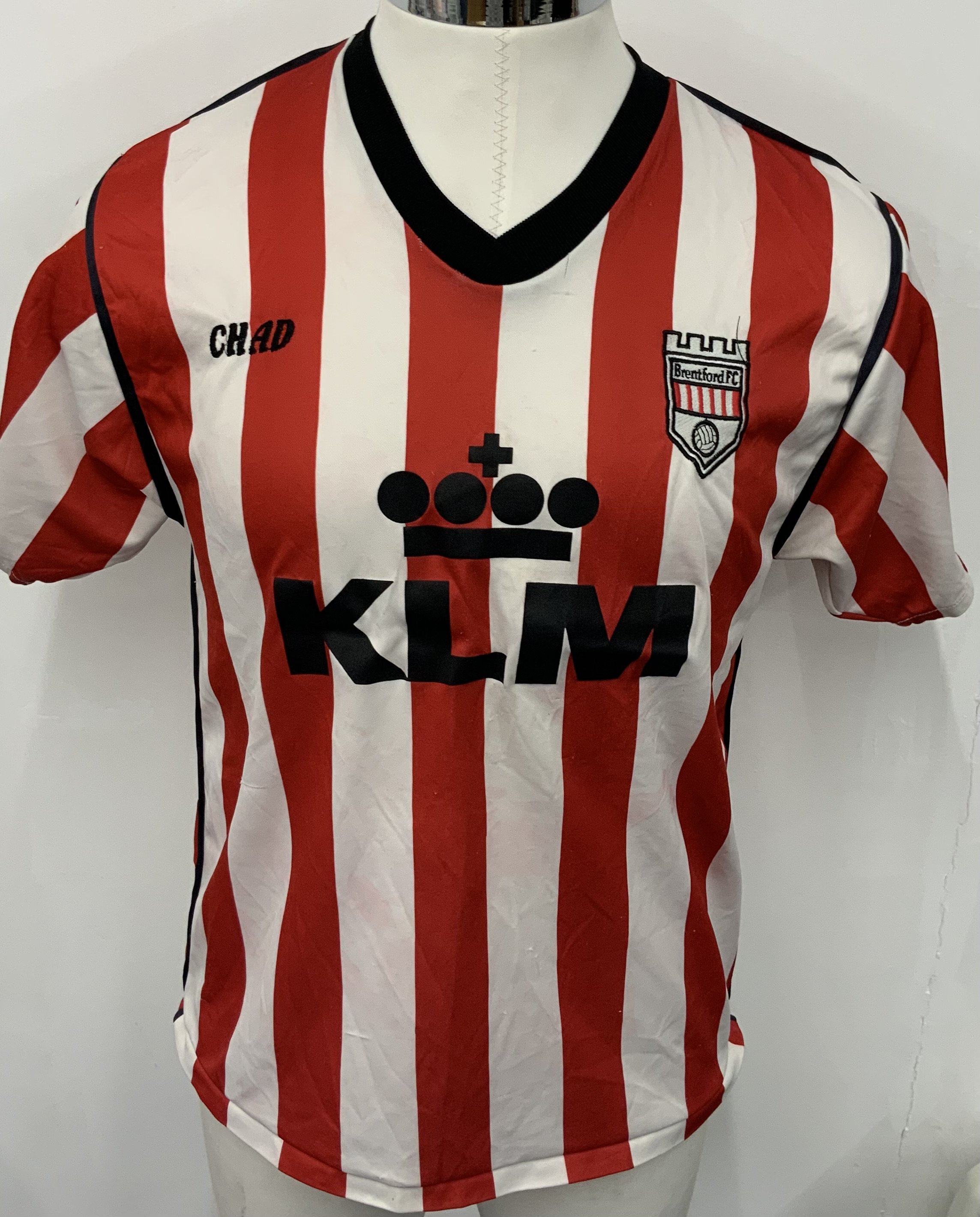 Brentford 1990 - 1992 Match Worn Football Shirt: Red and white striped Chad KLM short sleeve shirt. Number 9 to rear. 