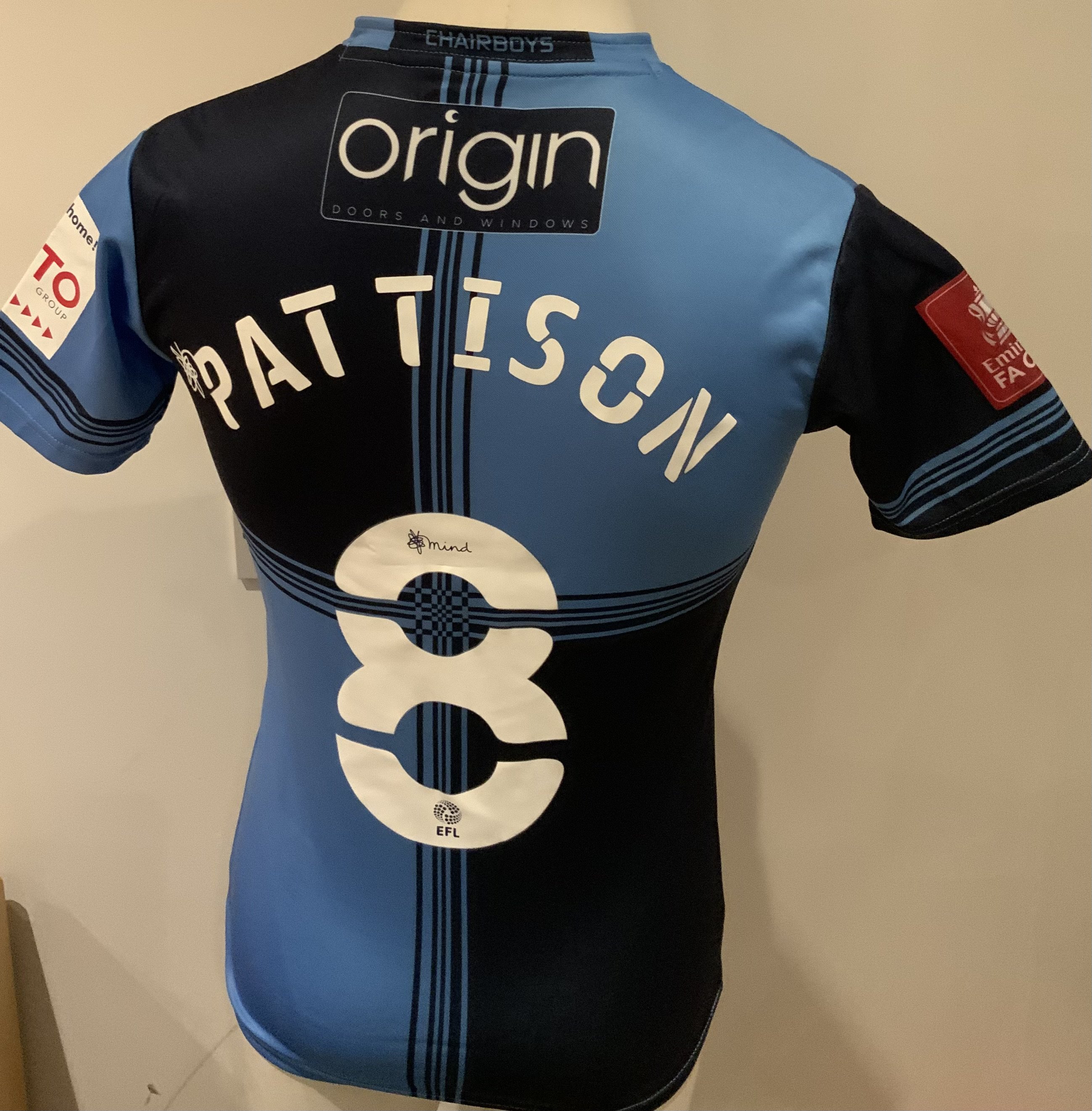 Wycombe Wanderers 2020 - 2021 Match Issued Football Shirt: Light and dark blue short sleeve shirt with FA Cup badging to sleeve. Pattison 8 to rear. Issued v Tottenham on 25 January 2021. Player was unused substitute. Front of shirt printed with match details.