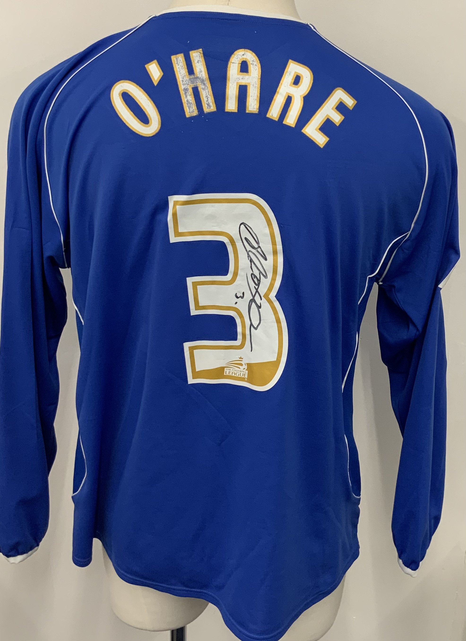 Chesterfield 2005 - 2006 Match Worn Football Shirt: Blue long sleeve with Coca Cola Football League badging to arms. Number 3 O Hare to rear. Signed by player to number. 