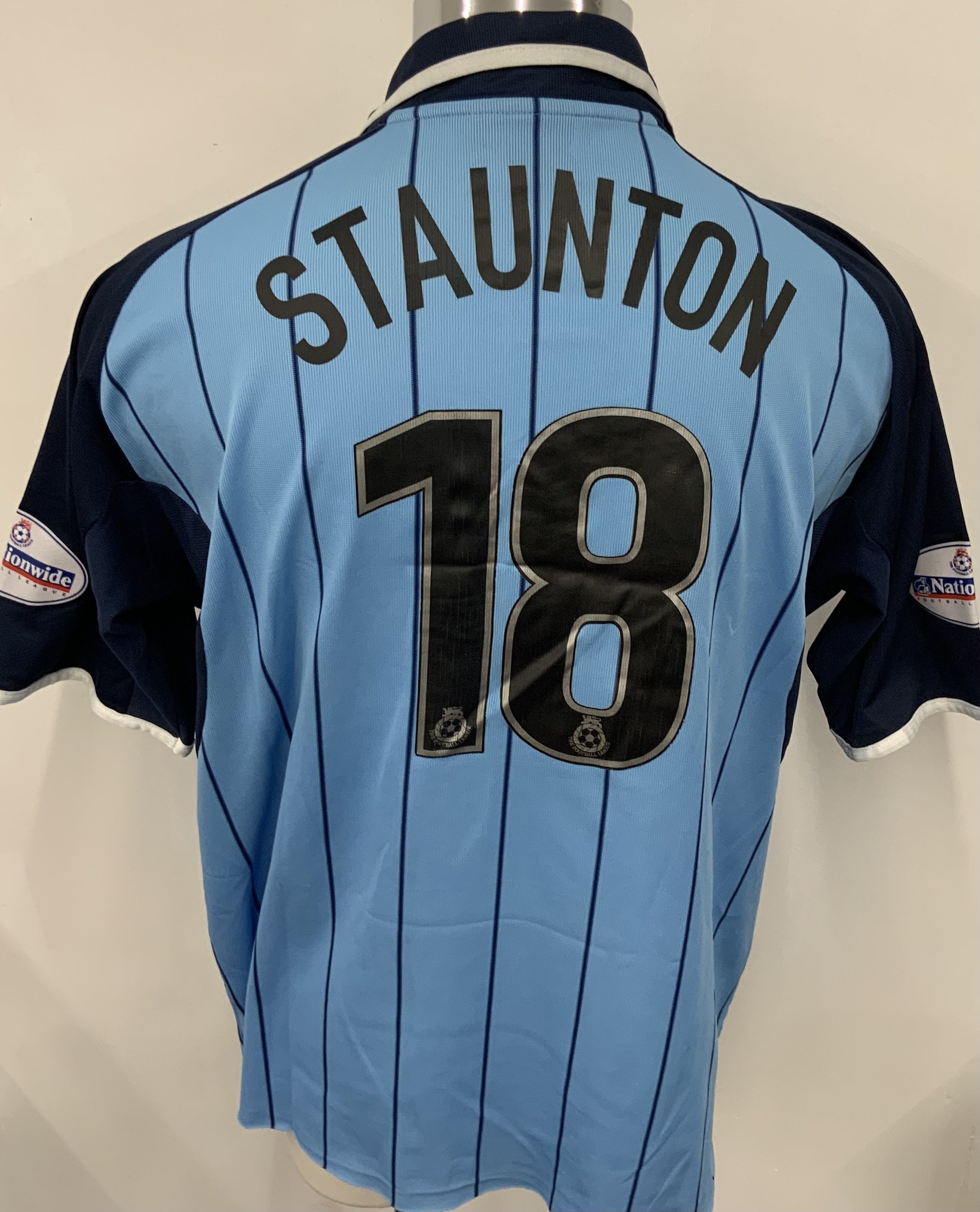 Coventry City 2003 - 2004 Match Worn Football Shirt: Blue short sleeve shirt. Number 18 Staunton. Nationwide League badging. Autographed by the player. 