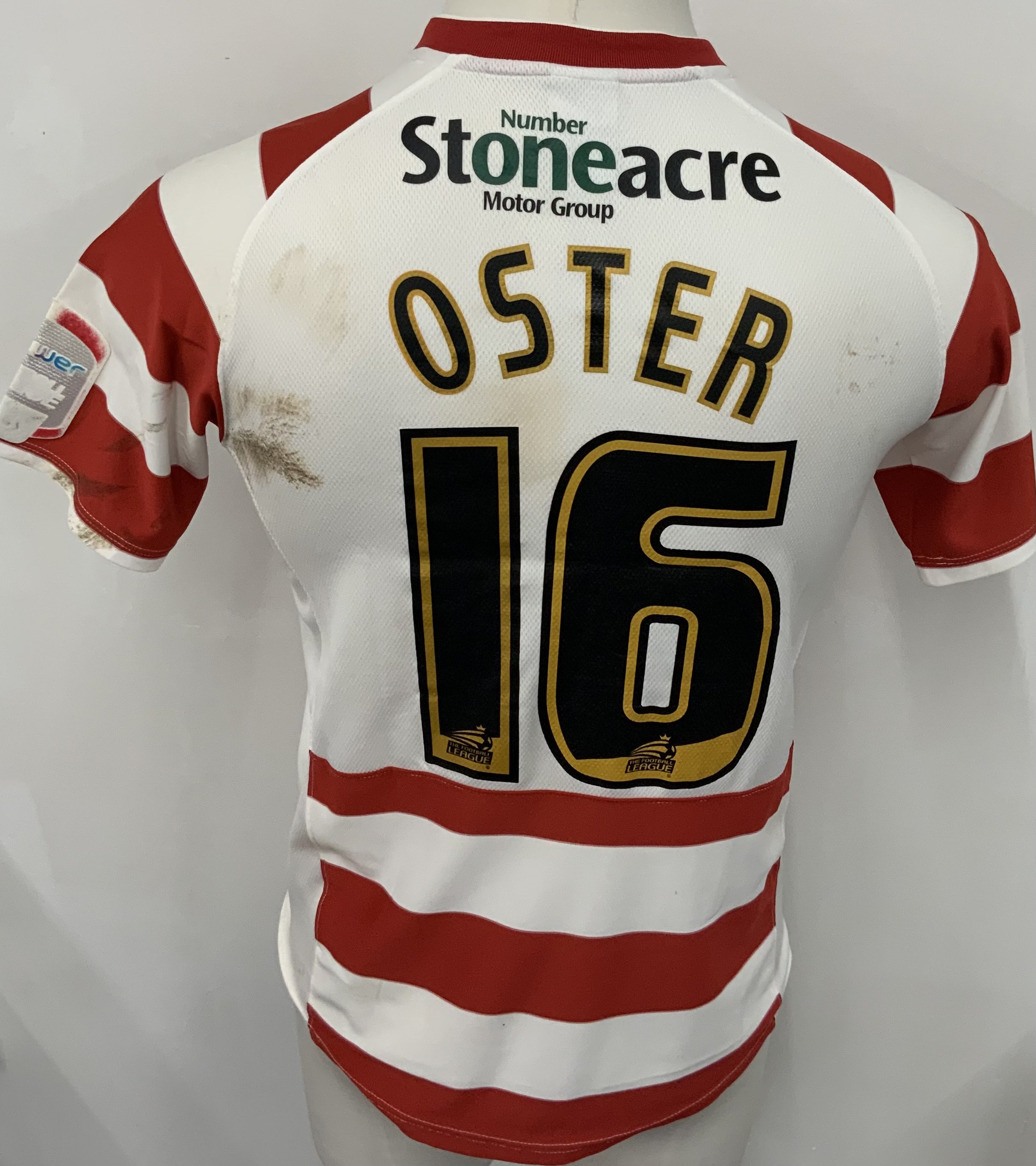 Doncaster Rovers 2010 - 2011 Match Worn Football Shirt: Red and white short sleeve shirt. Number 16 Oster. NPower League badging. Wear to badging and unwashed shirt.