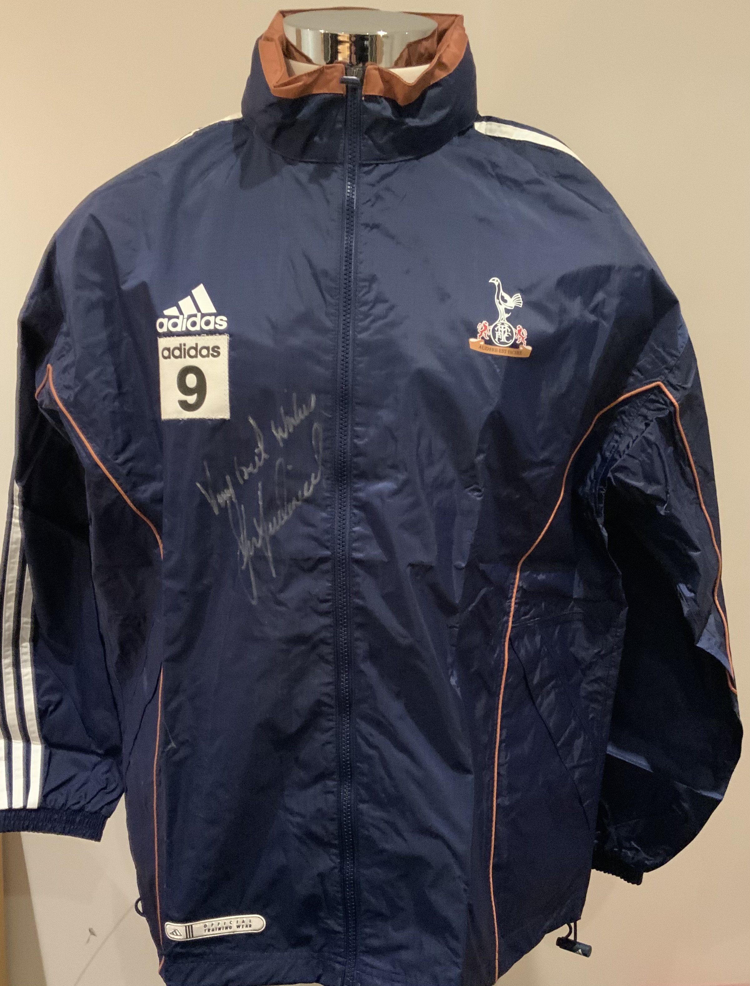 Tottenham 2000 - 2001 Football Players Training Kit: Number 9 used by Les Ferdinand. Comprises of rain jacket, one blue and one white Adidas Holsten tee shirt. Rain jacket is signed without dedication. (3)