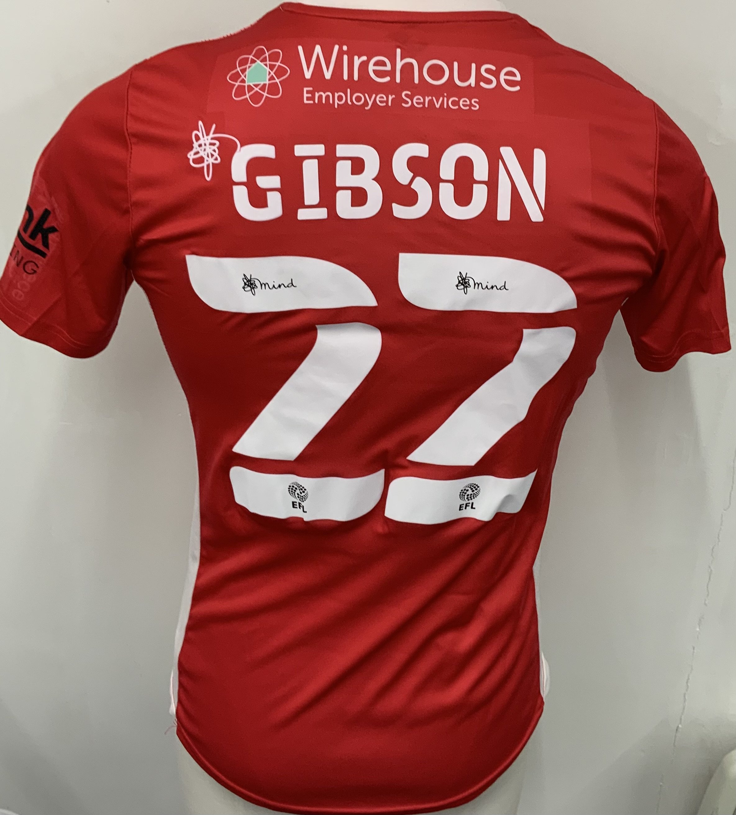 Morecambe 2021 - 2022 Match Worn Football Shirt: Red short sleeve shirt. Number 22 Gibson to rear. FA Cup sleeve badging. Worn v Spurs on 9 January 2022.