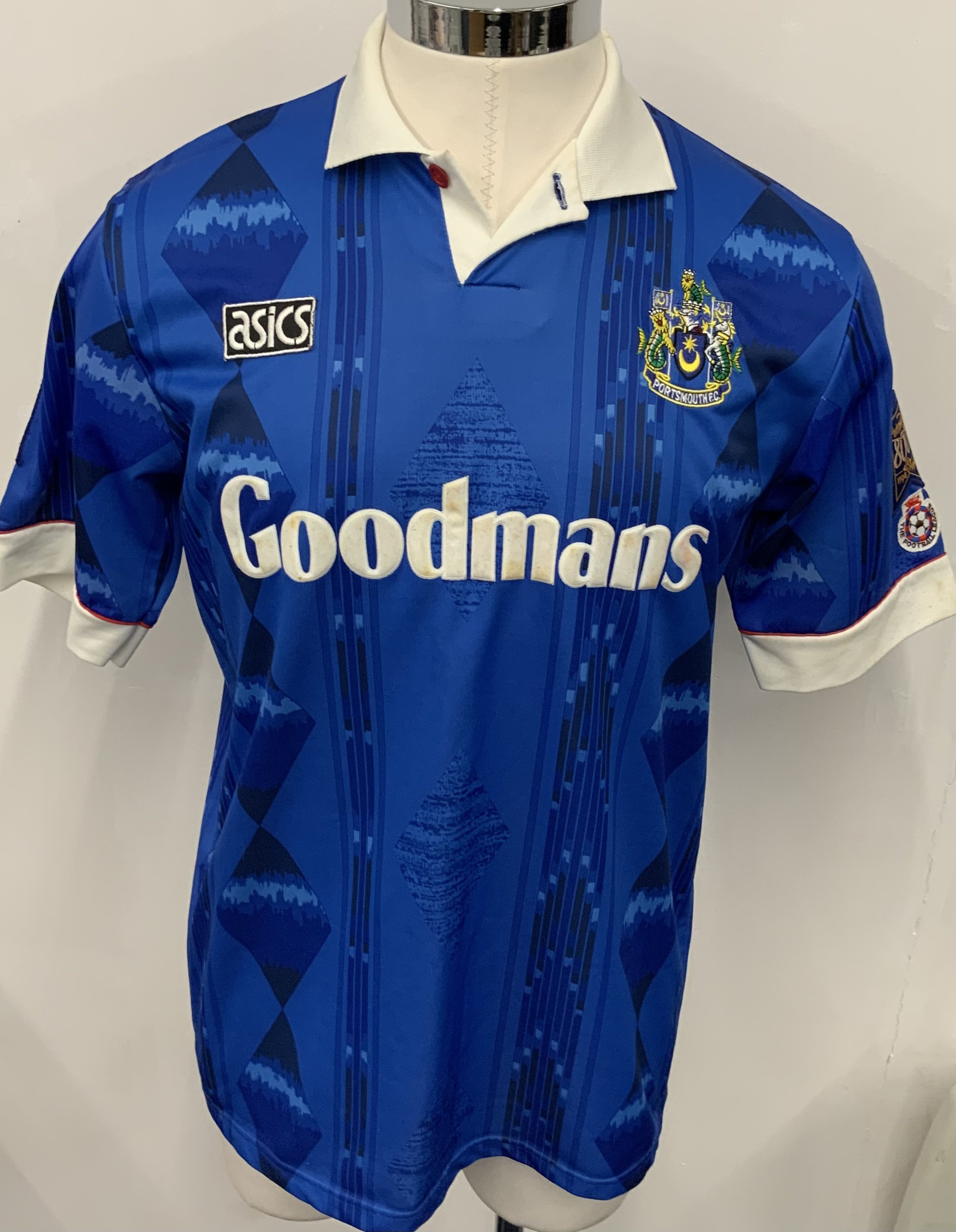 Portsmouth 1994 - 1995 Match Worn Signed Football Shirt: Blue Goodmans Asics short sleeve shirt with Football League badging to arms and 1194-1994 800 years. Number 7 to rear. 