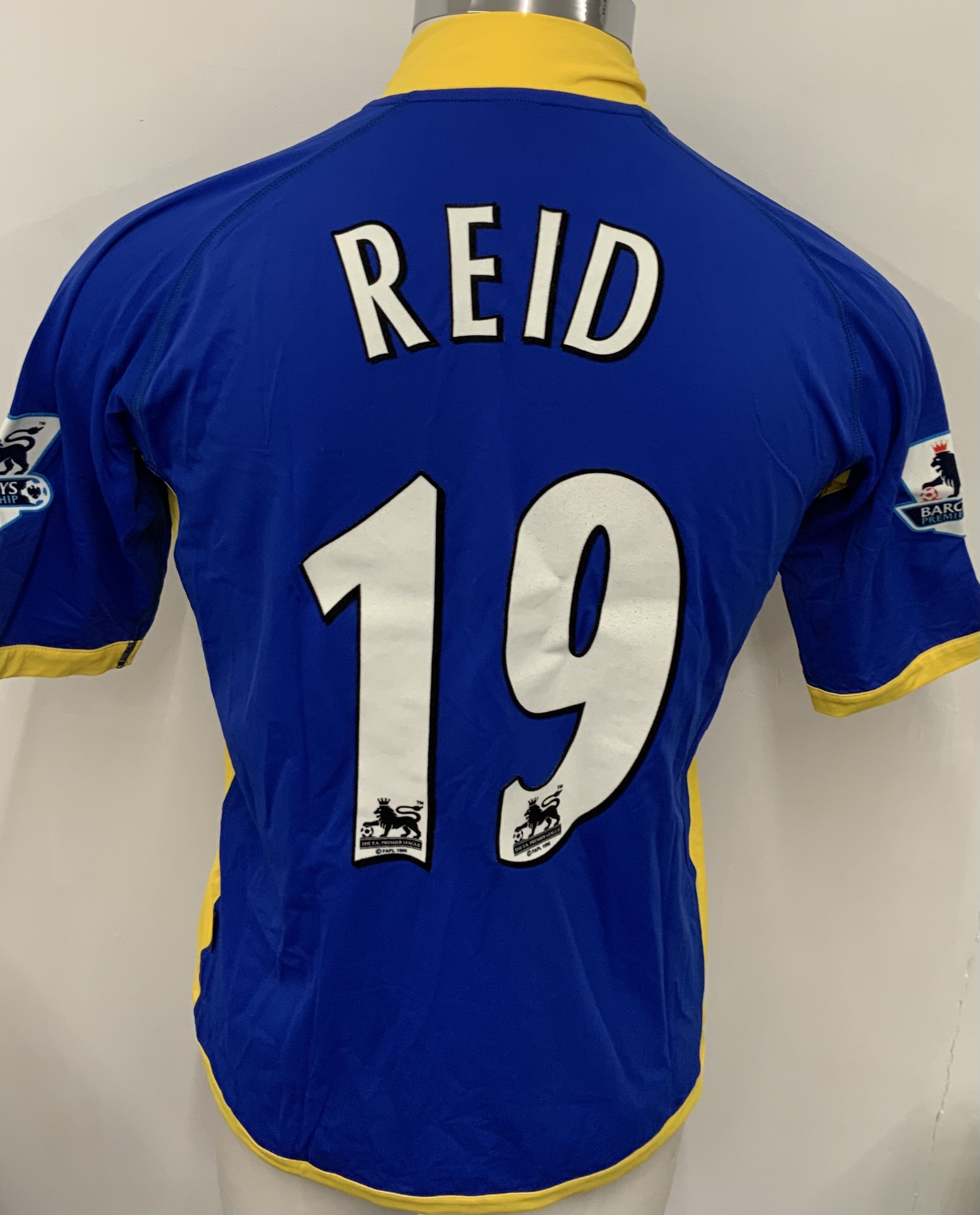 Tottenham 2005 - 2006 Match Worn Football Shirt: Blue short sleeve shirt with Reid 19 to rear. Worn v Fulham at Craven Cottage. Premier League badging to sleeves. 