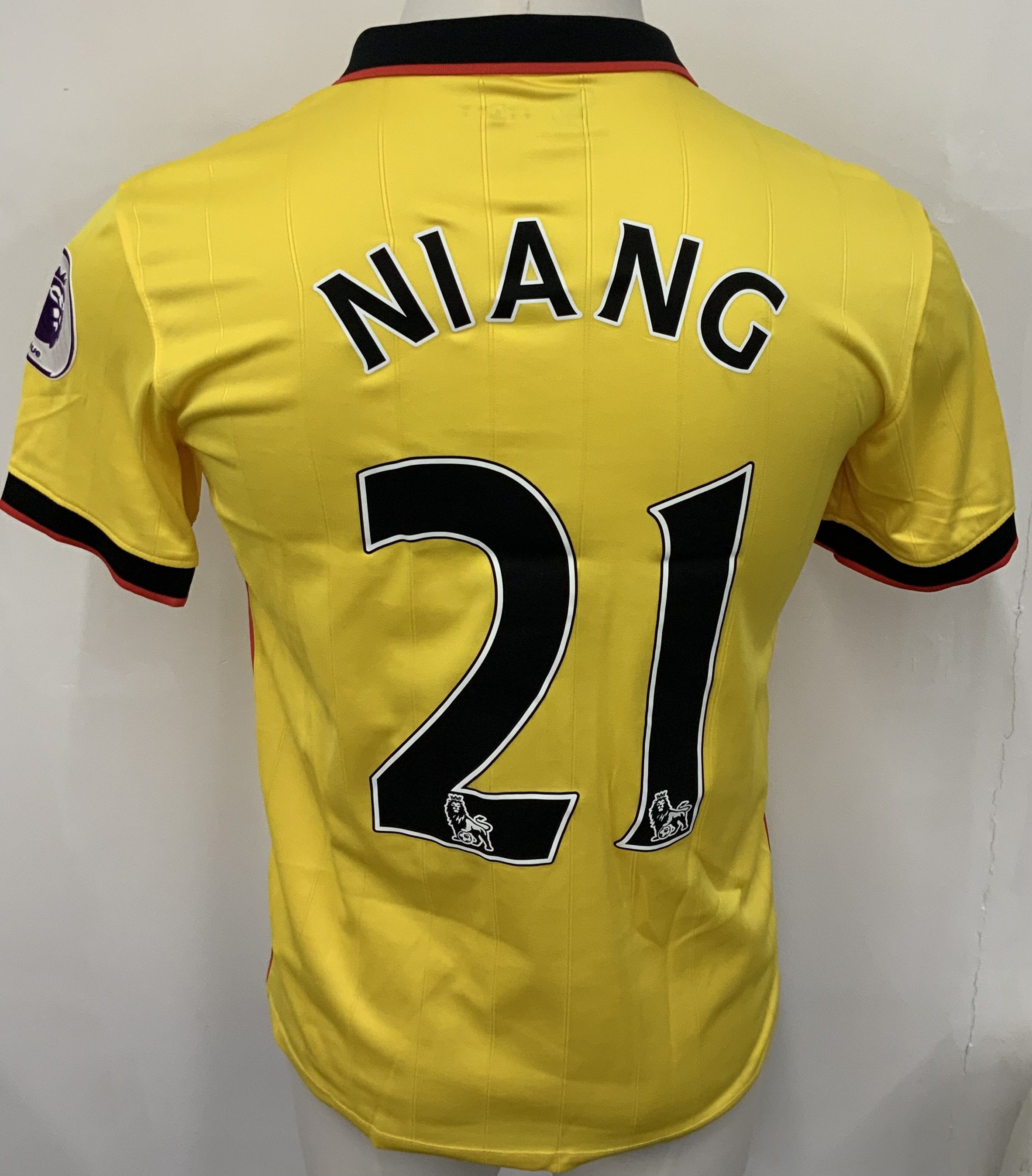 Watford 2016 - 2017 Match Worn Football Shirt: Yellow short sleeve shirt. Number 21 Niang to rear. Premier League badging. Worn v Tottenham on 8 April 2017.