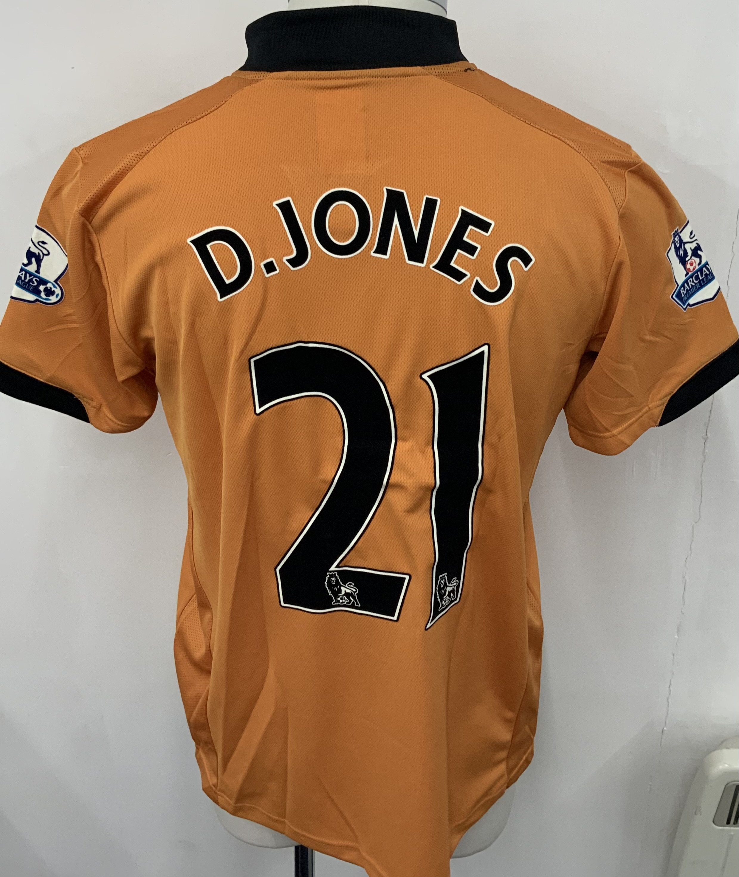 Wolves 2009 - 2010 Match Worn Football Shirt: Gold short sleeve shirt. Number 21 Jones to rear. Premier League badging. 