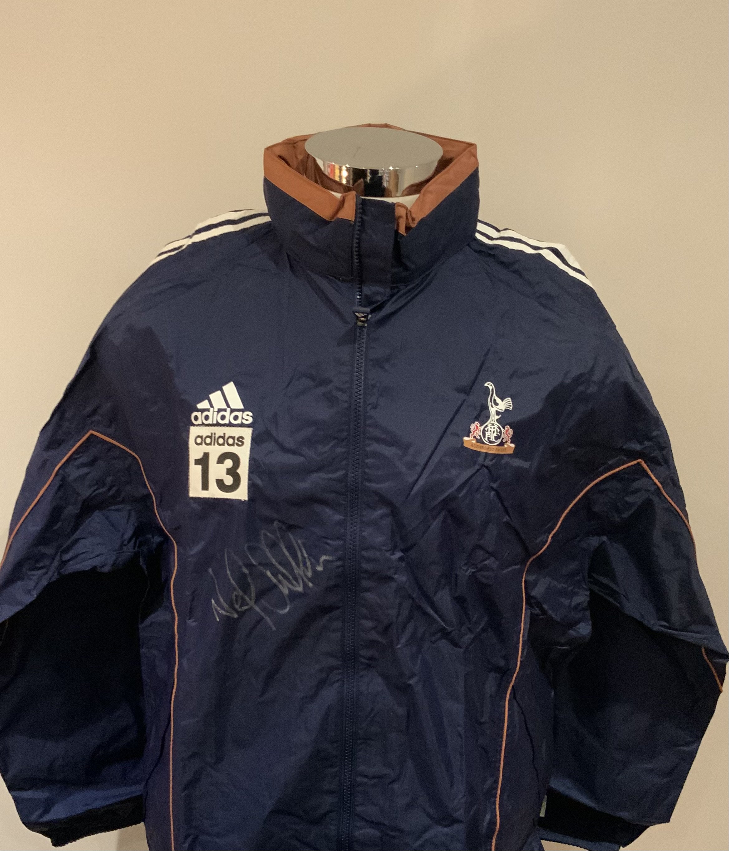 Tottenham 2000 - 2001 Football Players Training Kit: Number 13 used by Neil Sullivan. Comprises of rain jacket which is signed by Sullivan plus blue Adidas Holsten sweatshirt and matching white tee shirt. (3)