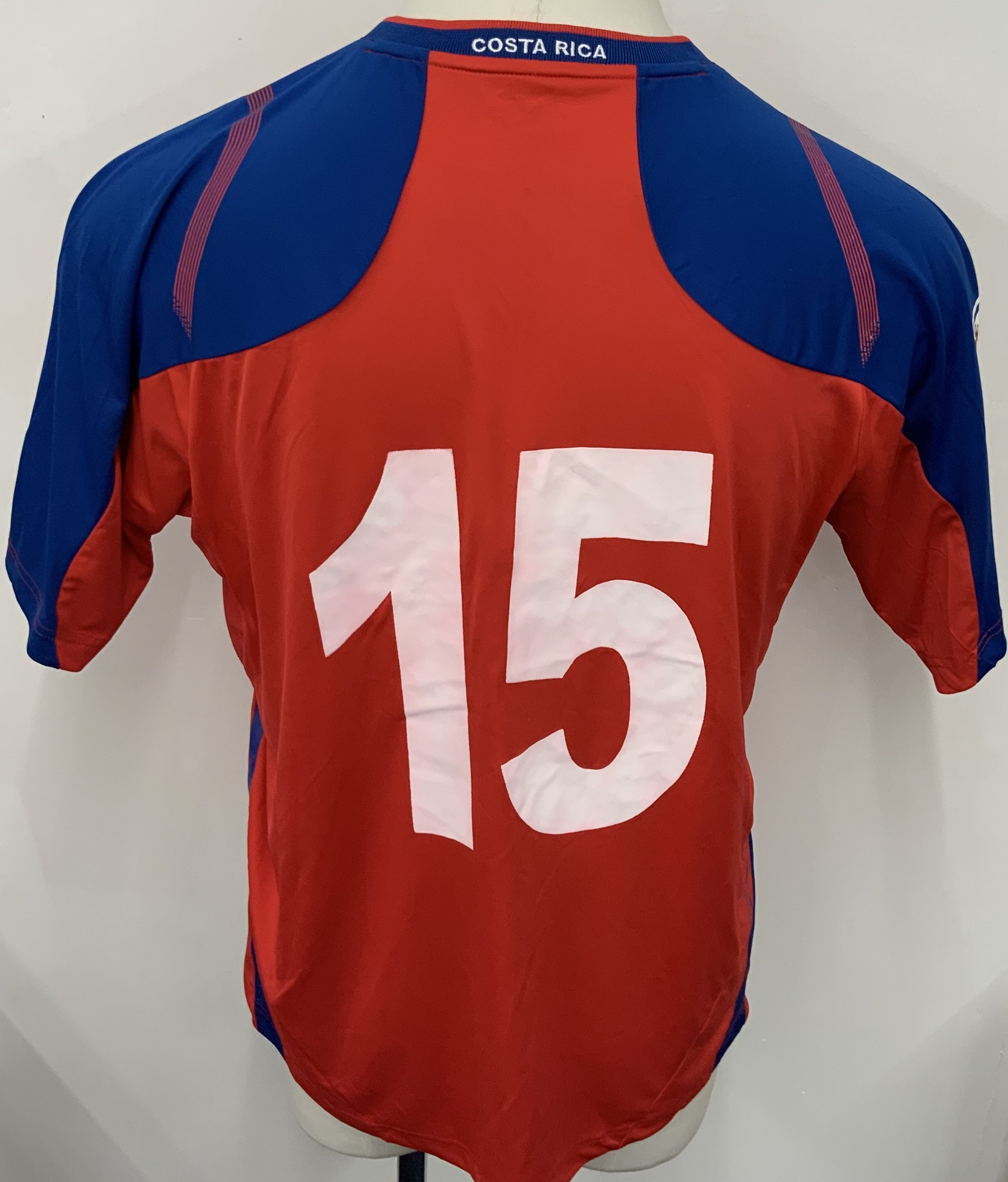 Costa Rica 2009 Match Worn Football Shirt: Red short sleeve shirt. Number 15. Worn by Junior Diaz in World Cup Qualifier v Uruguay on 14 November 2009. World Cup badge to sleeve. 