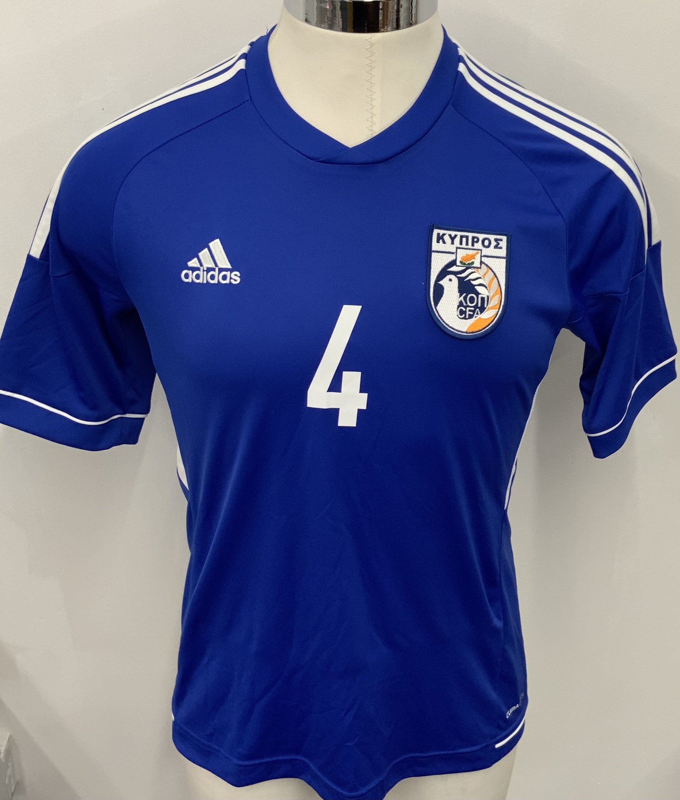 Cyprus 2014 Match Issued Football Shirt: Blue short sleeve shirt. Number 4 Merkis. Issued for friendly v Croatia on 4 September 2014.