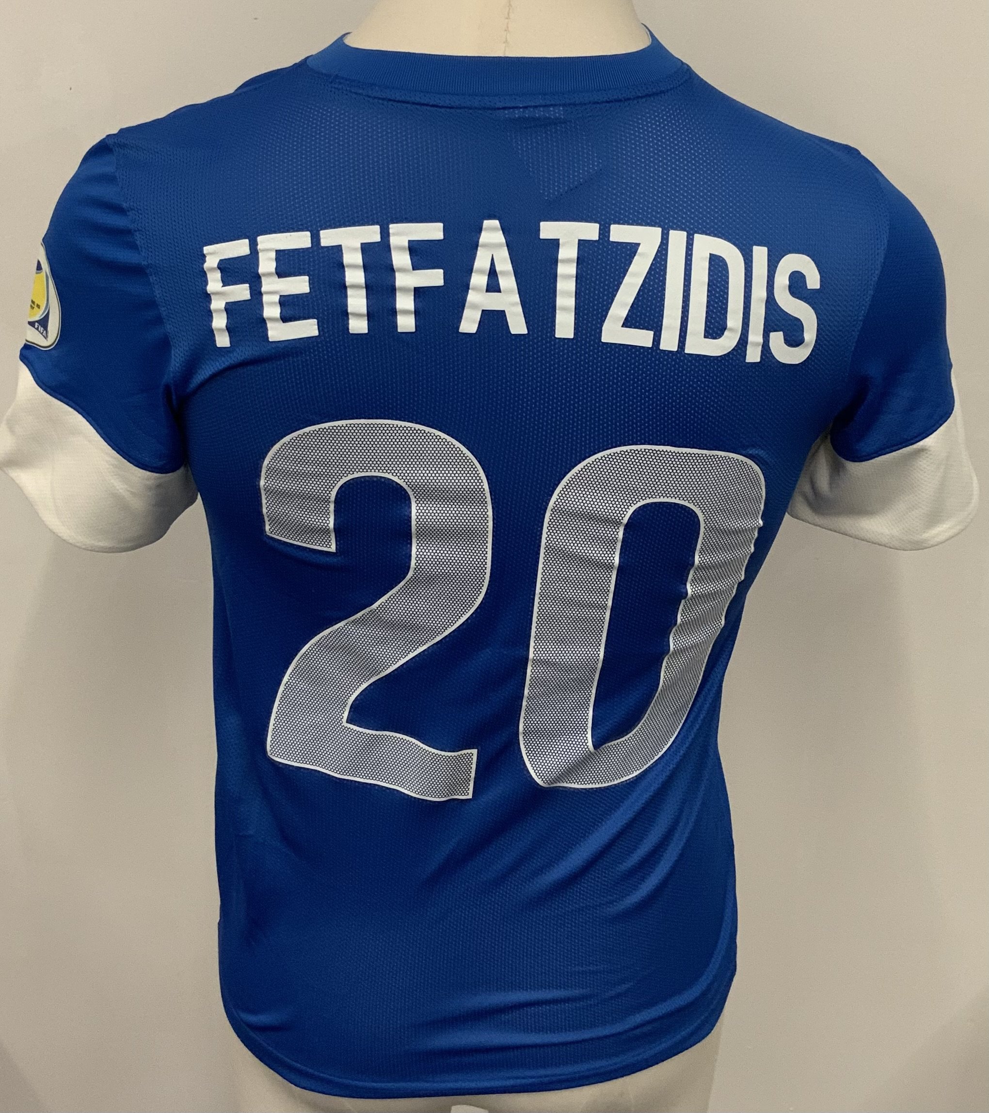 Greece 2010 Match Worn Football Shirt: Blue short sleeve shirt. Number 20 Fetfatzidis. Worn v Latvia in World Cup qualifier on 10 September 2013. World Cup badge to sleeve. 