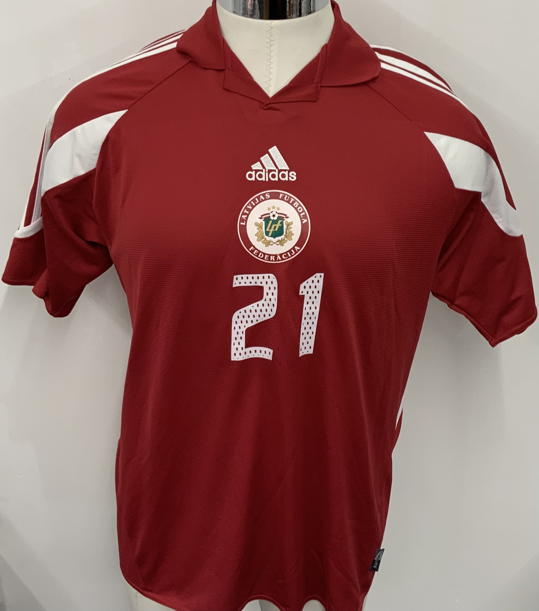 Latvia 2005 Match Issued Football Shirt: Red short sleeve shirt. Number 21. Issued for World Cup Qualifier v Slovakia on 7 September 2005. Germany 2006 sleeve badge has detached but is included. 