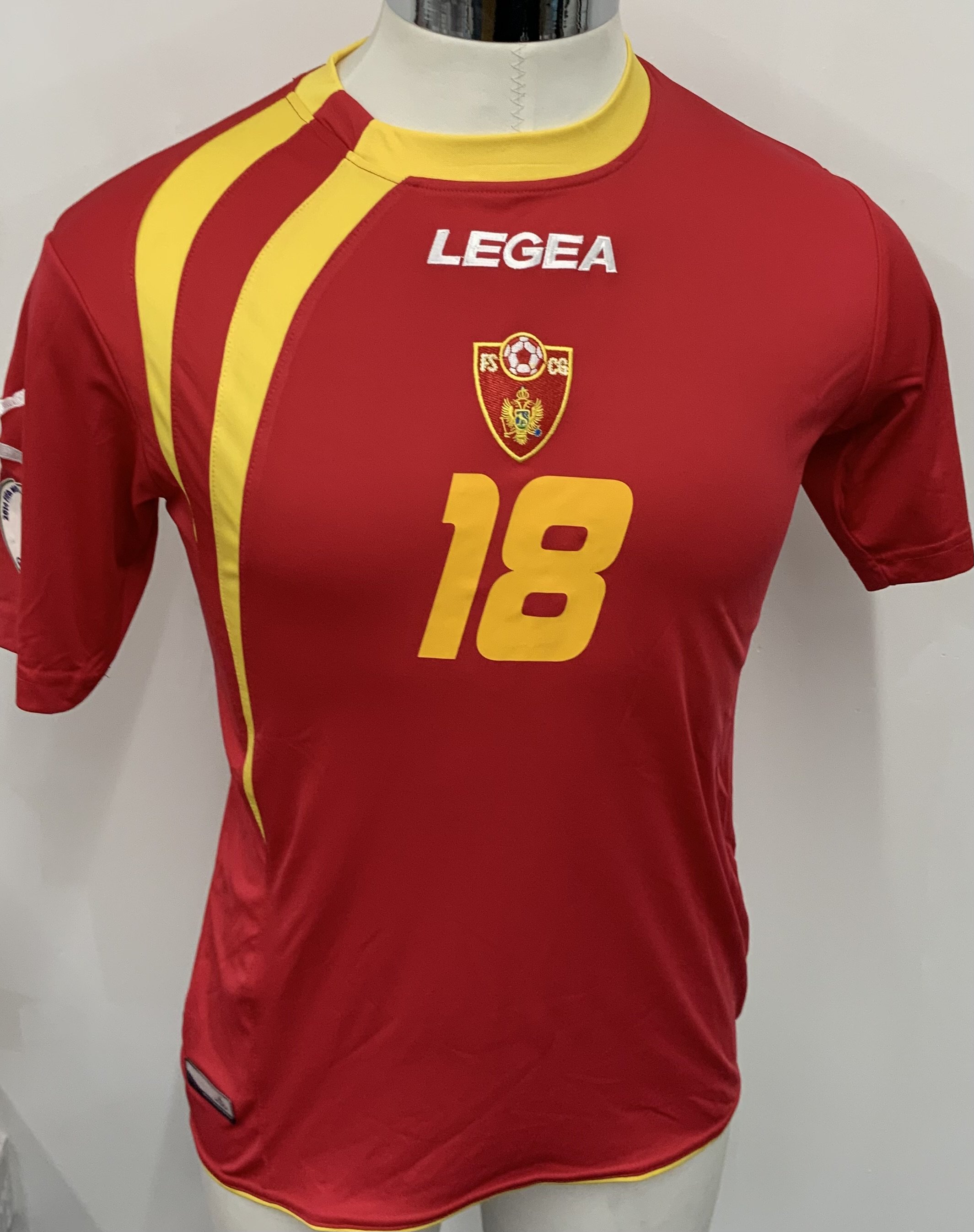 Montenegro 2014 Match Worn Football Shirt: Red short sleeve shirt. Number 18. Worn during World Cup Qualifiers.
