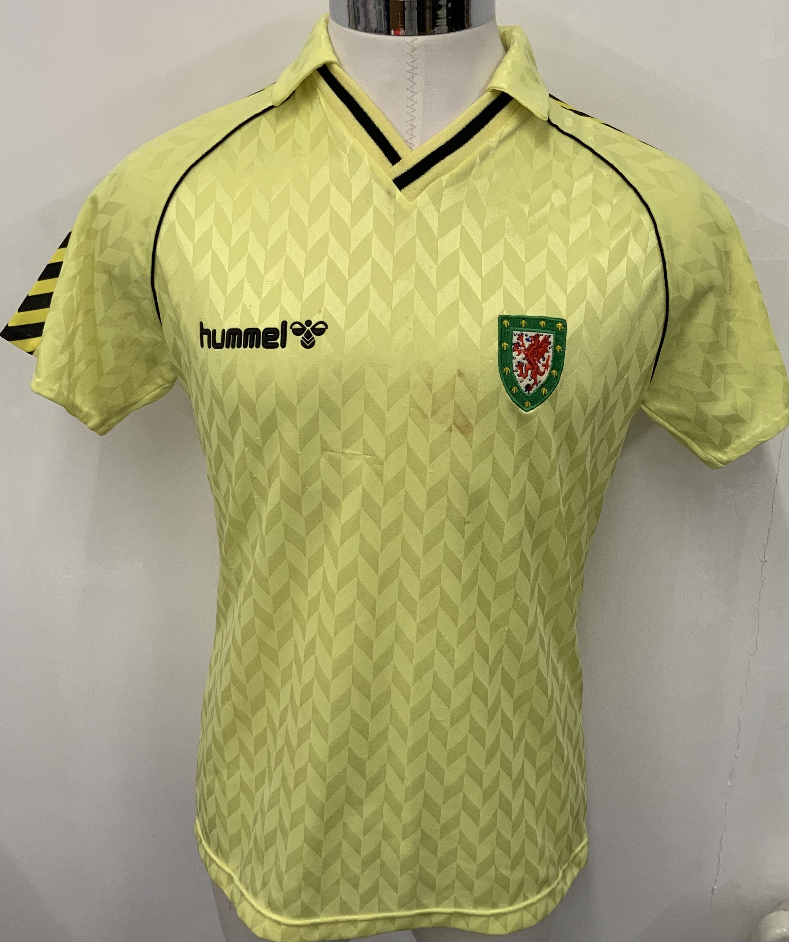 Wales 1987 Match Worn Away Football Kit: Yellow large Hummel short sleeve number 7 with tiny mark and scuff to chest. C/W red shorts from same source but not necessarily worn in same match. 