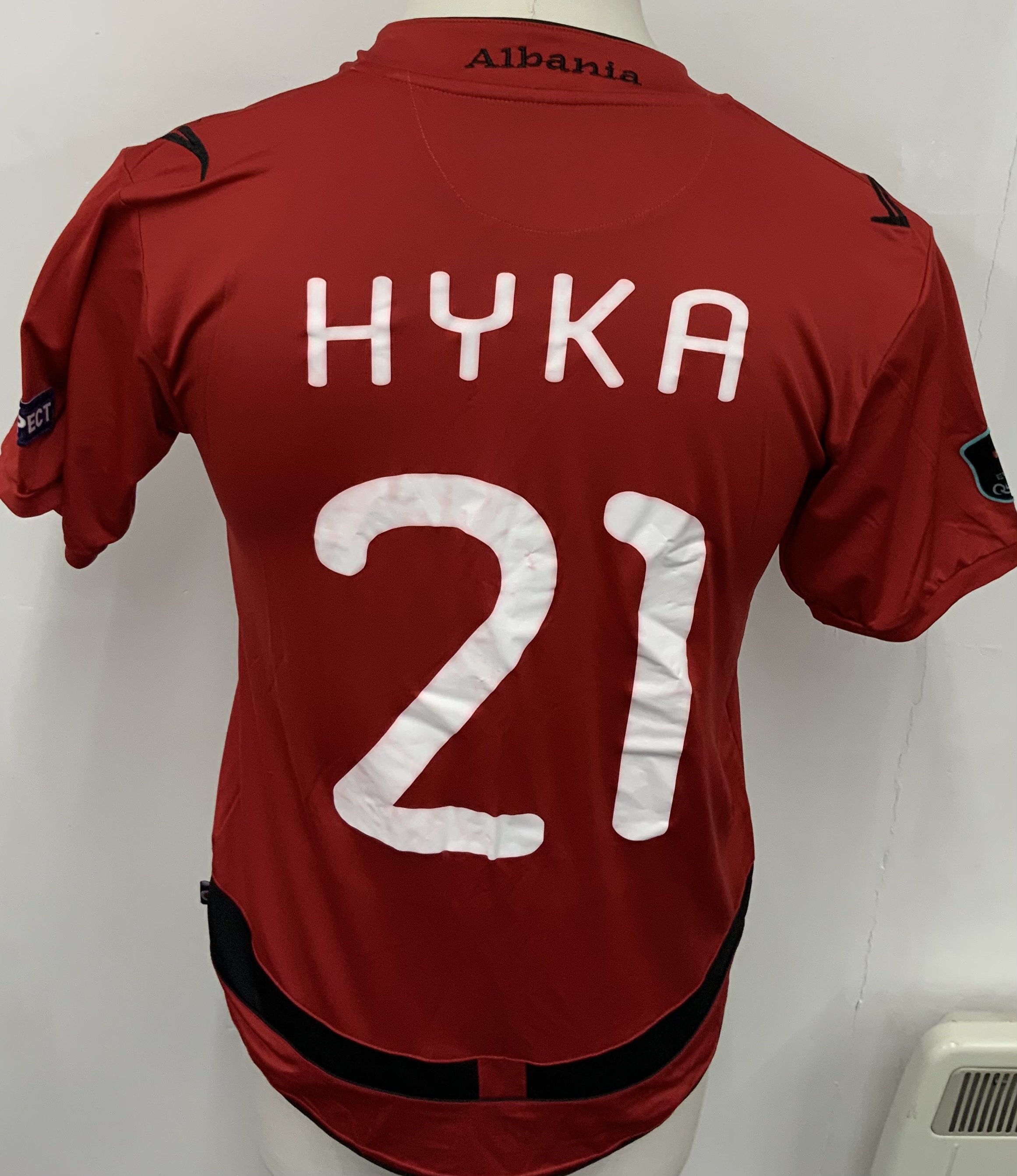 Albania 2011 Match Worn Football Shirt: Red short sleeve shirt. Number 21 Hyka. Worn v Romania in Euros Qualifier on 11 October 2011. Euros badging to sleeves. 
