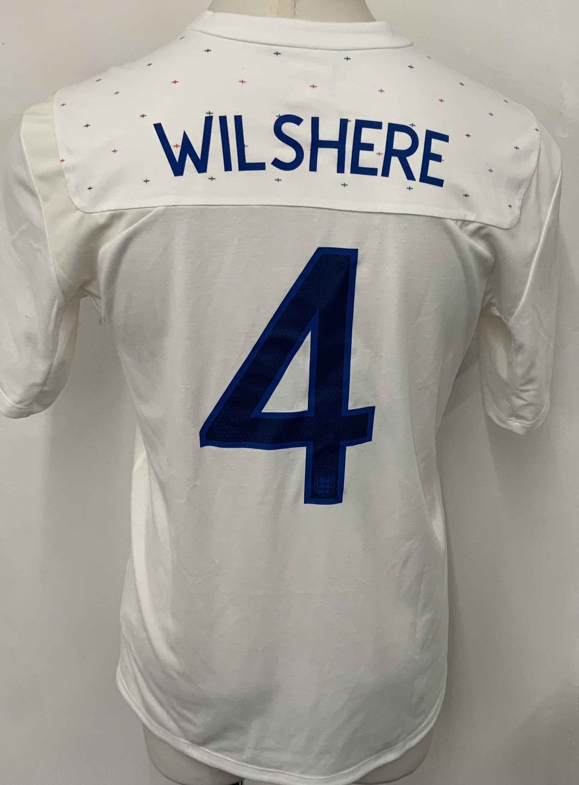 England 2010 - 2011 Wilshere Match Issued England Football Shirt: White short sleeve Umbro shirt with number 4 Wilshere to rear. Issued v Denmark on 9 February 2011. 