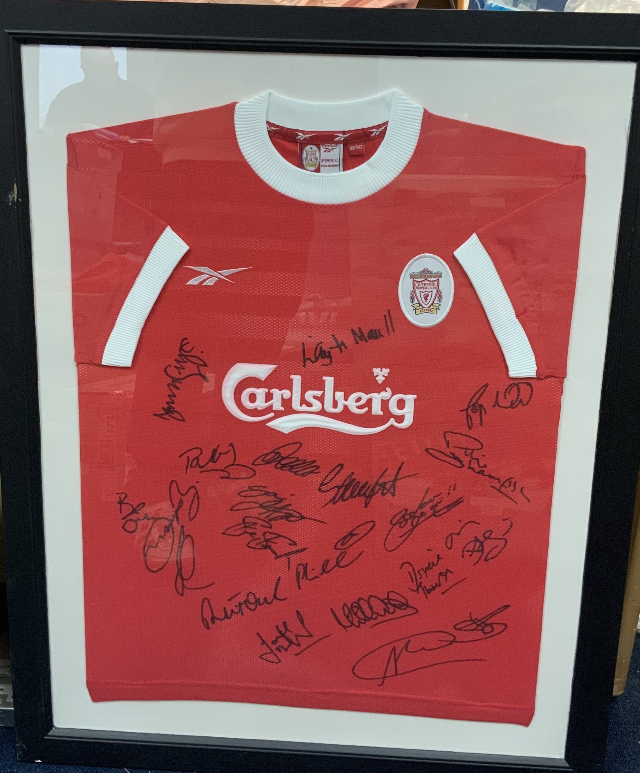 Liverpool 1999 - 2000 Signed Framed Football Shirt: Original home size 38/40 shirt multi signed by squad including Michael Owen. Frame measures approximately 38 inches by 30 inches. No COA. Not for posting. 