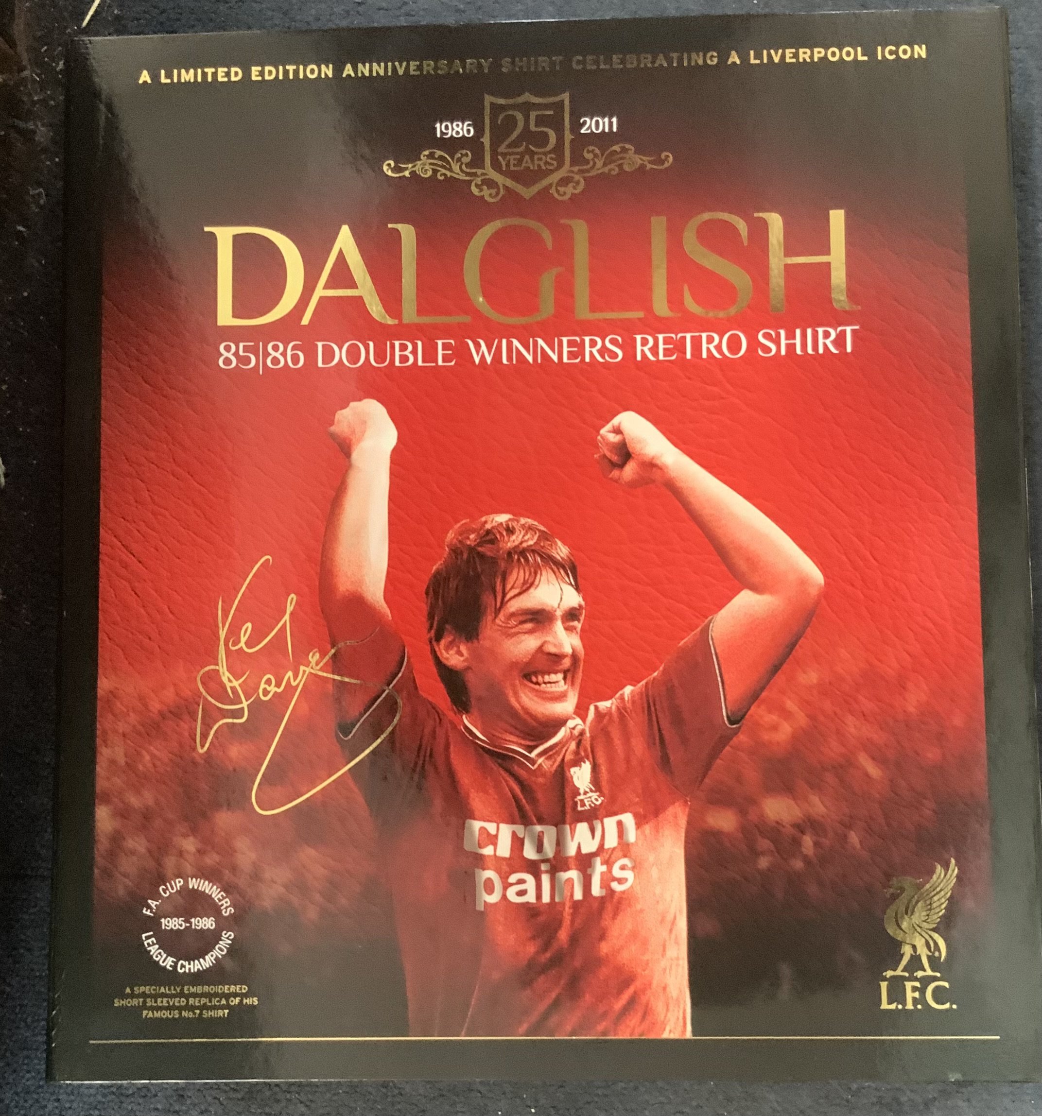 Boxed Liverpool 1985 - 1986 Double Winners Football Shirt: Signed with dedication by Kenny Dalglish to number 7. Bi-fold box in slip case also contains replica medal and season DVD. 