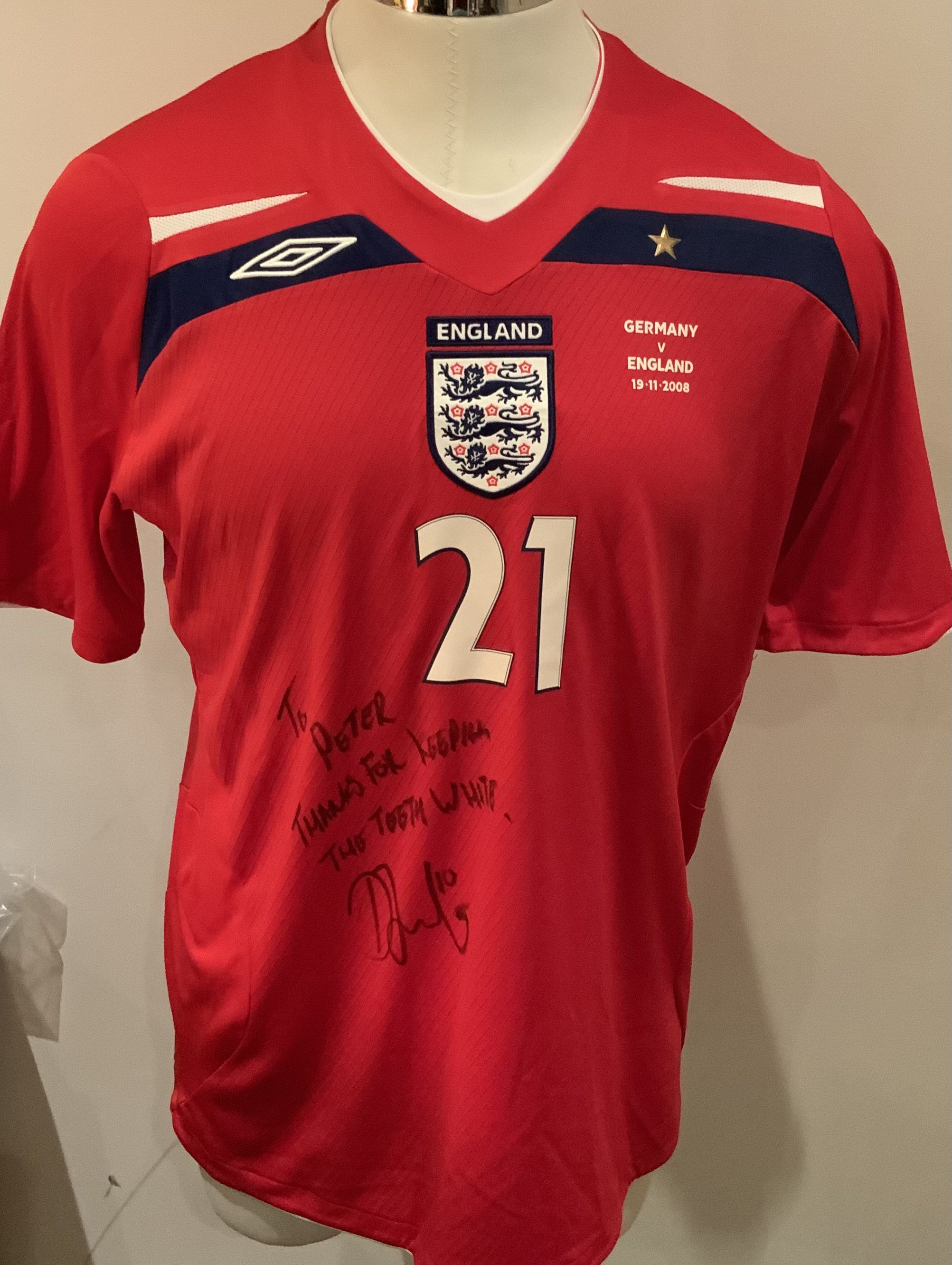 England 2008 Match Worn Football Shirt: Red short sleeve shirt with Bent 21 to rear. Worn in the match v Germany on 19 11 2008. Played in the second half. Signed with dedication by the player. 