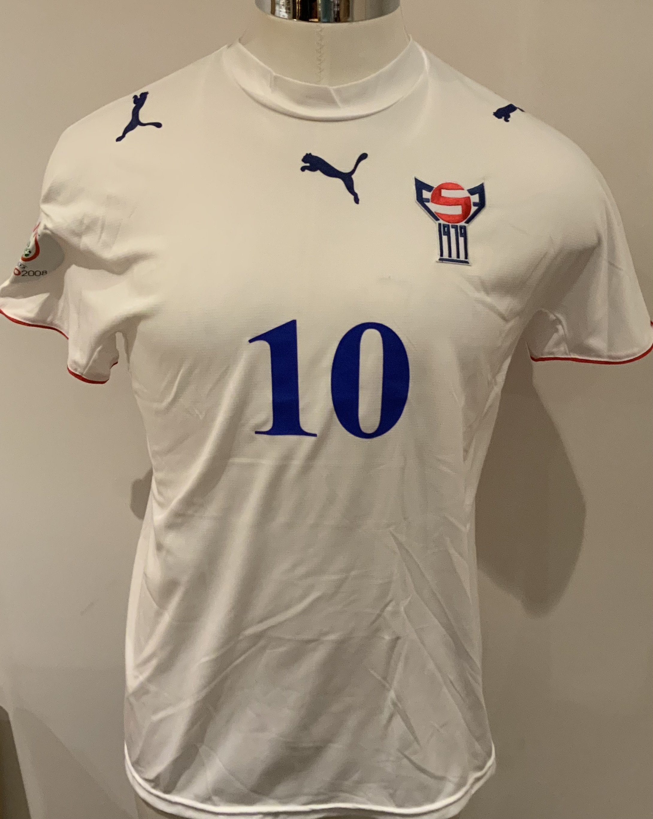 Faroe Islands Match Worn Football Shirt: White short sleeve shirt with number 10 to rear. Worn in Euro 2008 qualifying tournament v Scotland on 2 September 2006. Worn by Christian Hogni Jacobsen.