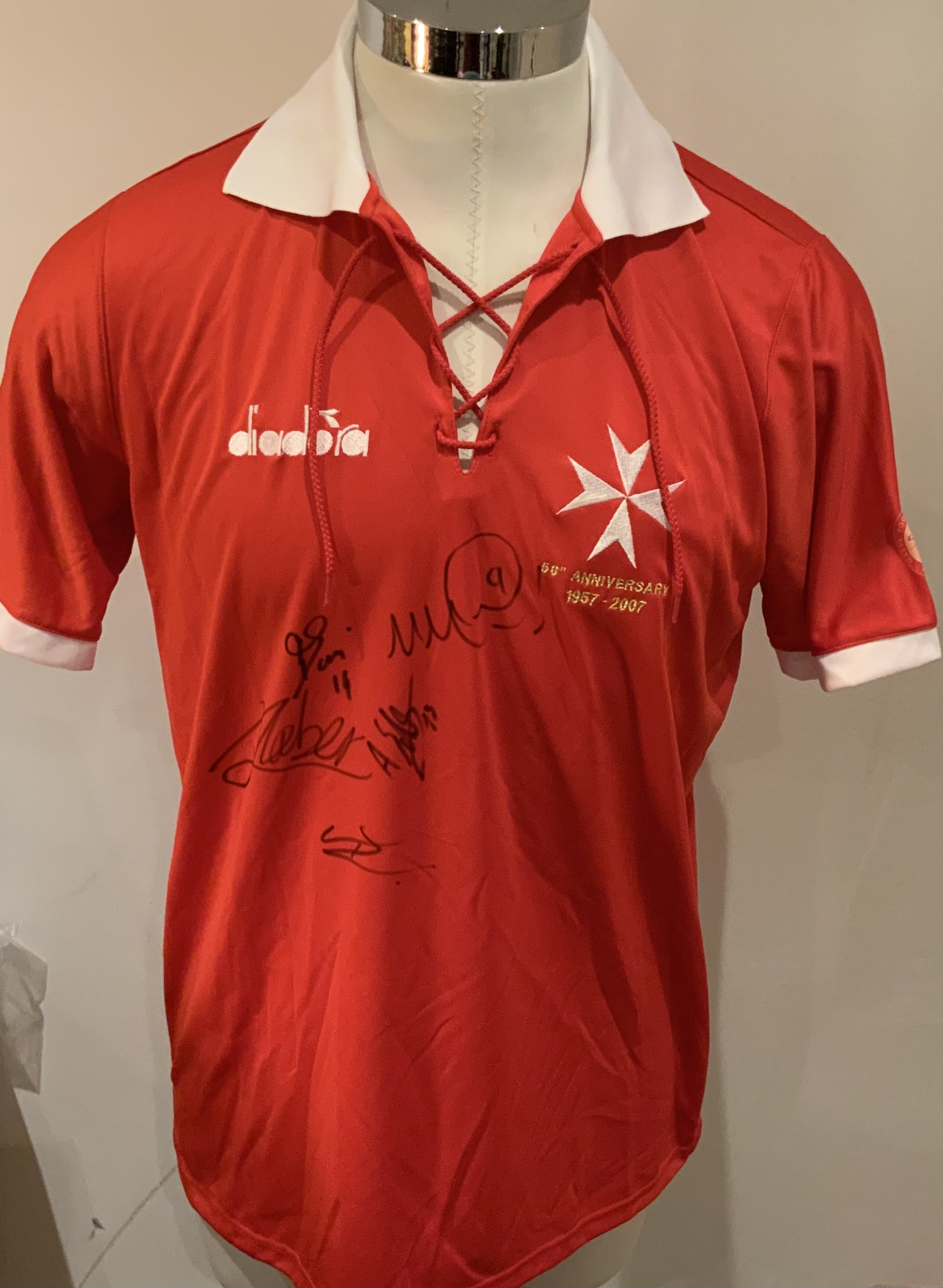 Malta Match Worn Football Shirt: Red short sleeve Diadora shirt with number 10 to rear. Signed to front by 5 Players 
