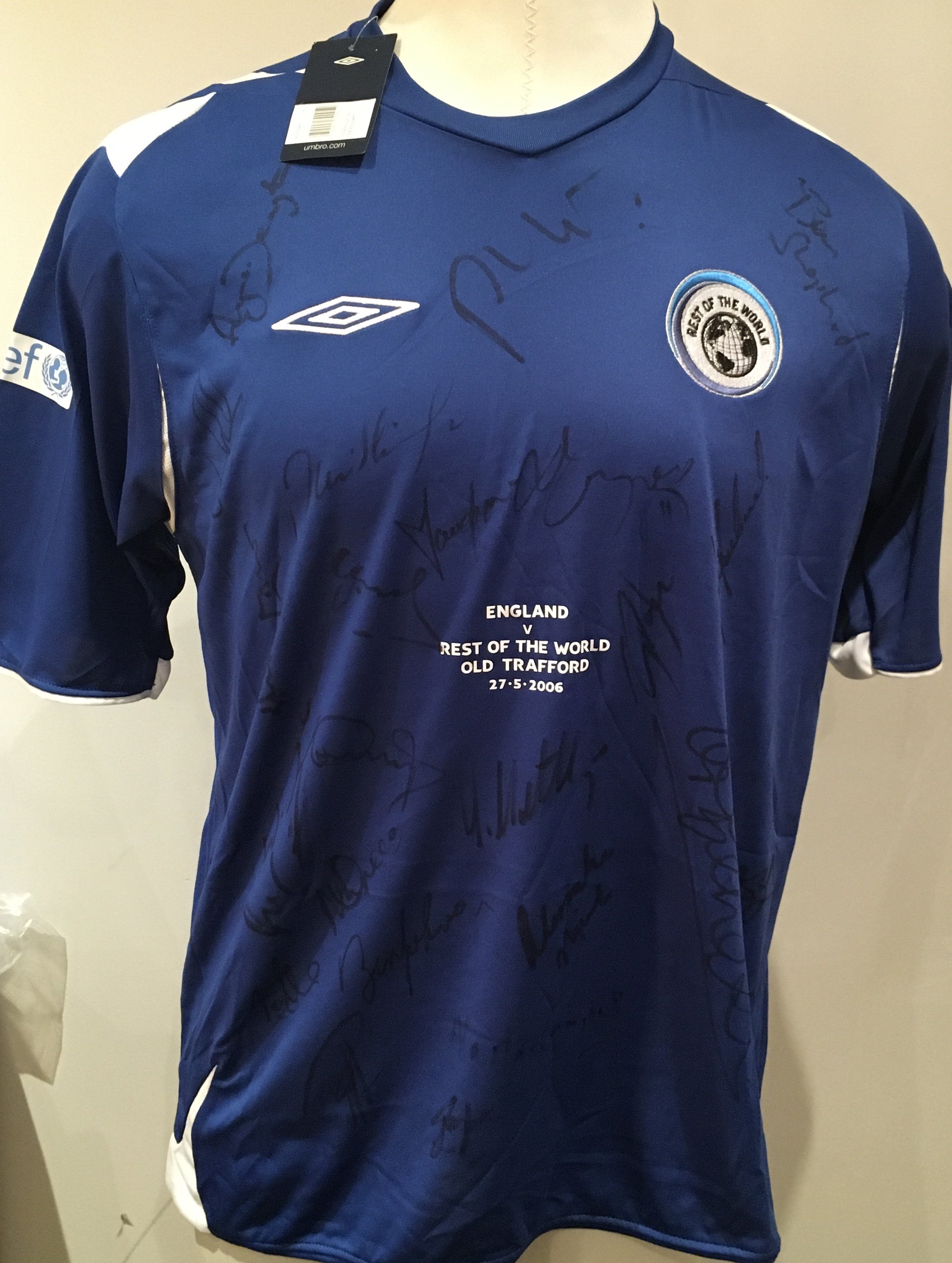 England v Rest Of The World Fully Signed Soccer Aid Football Shirts: Incredibly rare match prepared shirts for both teams in the first ever Soccer Aid in 2006.
Unused with labels attached sent back to Umbro as a thank you for supplying both kits for free. 
Shirts never available for sale so no price label on tags.
26 genuine autographs on England shirt with 23 on Rest Of The World shirt. 
Autographs include Robbie Williams Angus Deayton Ben Shepherd David Seaman Terry Venebles Gazza Les Ferdinand and Gordon Ramsey.
