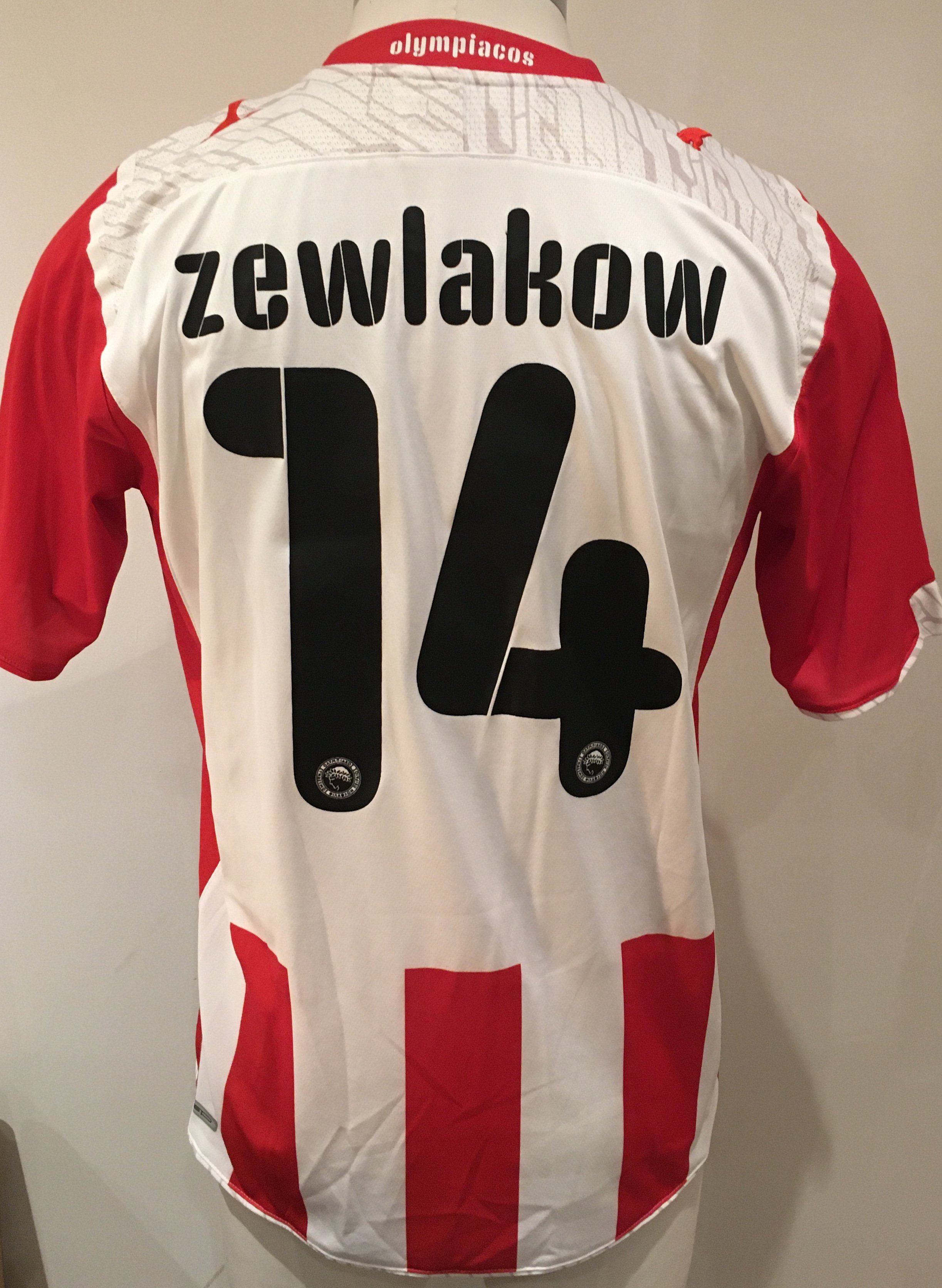 Olympiakos 2009 - 2010 Match Worn Football Shirt: Red and white short sleeve shirt with Zewlakow 14 to rear. Worn v Tottenham on 9 August 2009 in a friendly match.