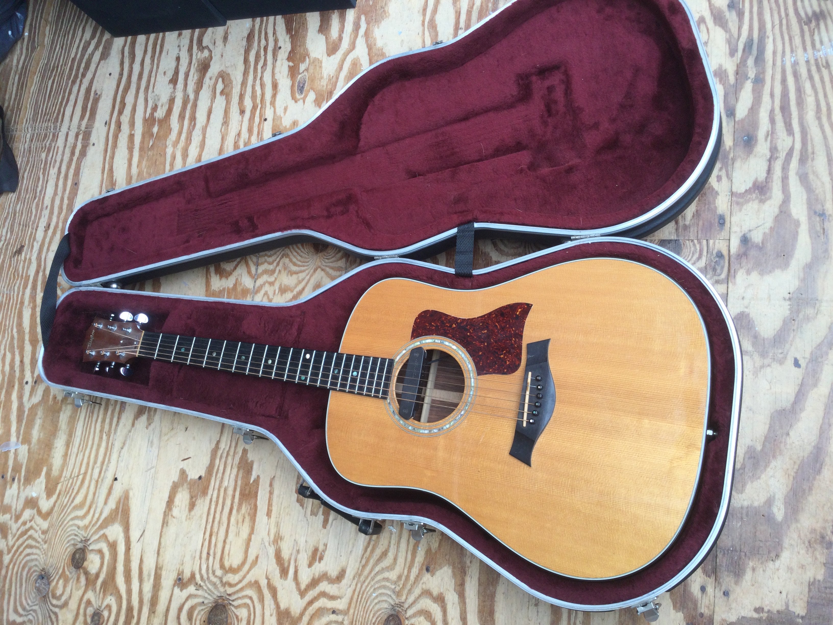 A Taylor 710 acoustic guitar fitted with a Fishman pickup. Comes with original hard shell Taylor branded case.