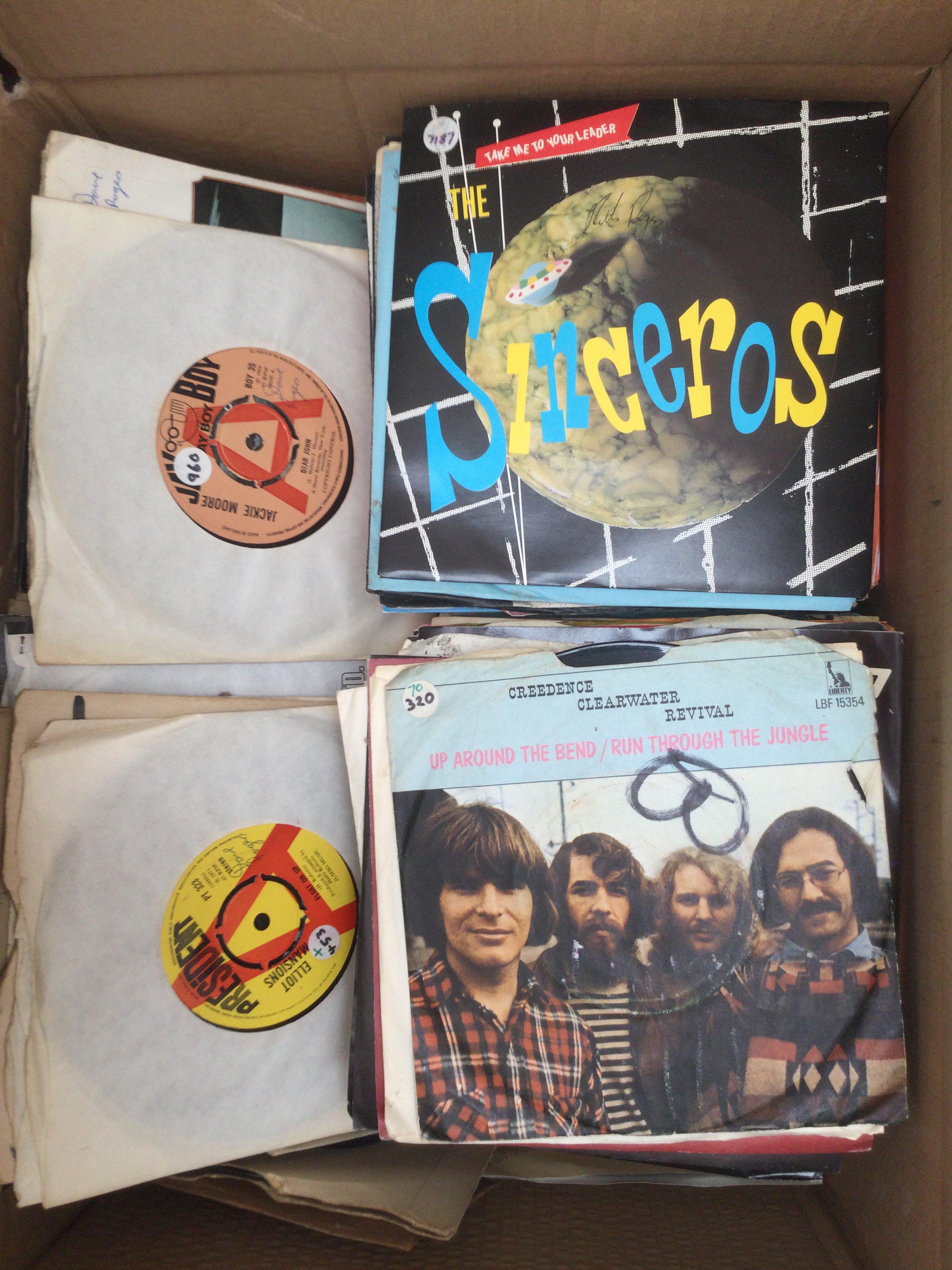 Two boxes of 7" singles by various artists including The Rolling Stones, The Who, Yes and many more.