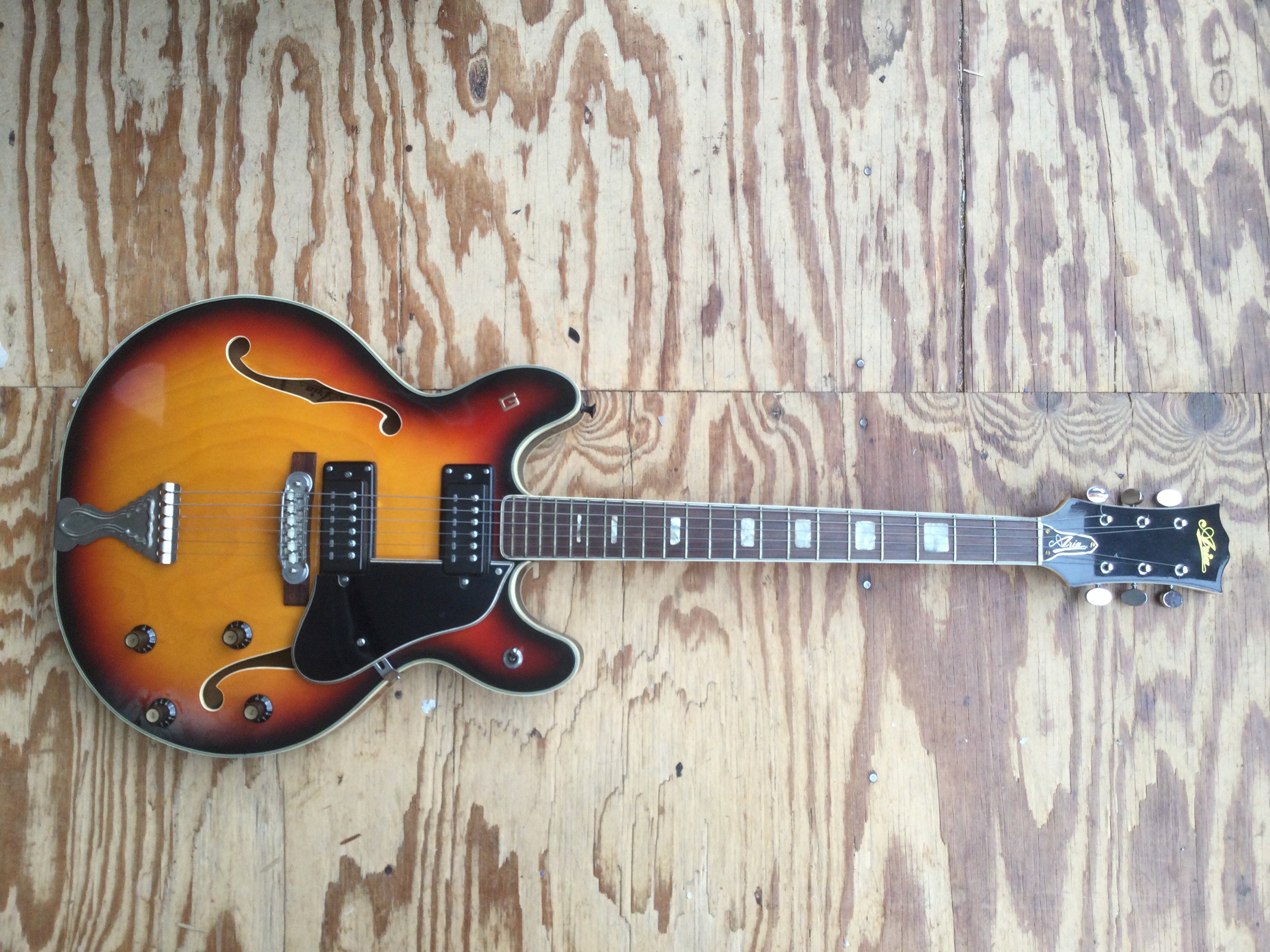 An Aria 5102T electric guitar, no case.