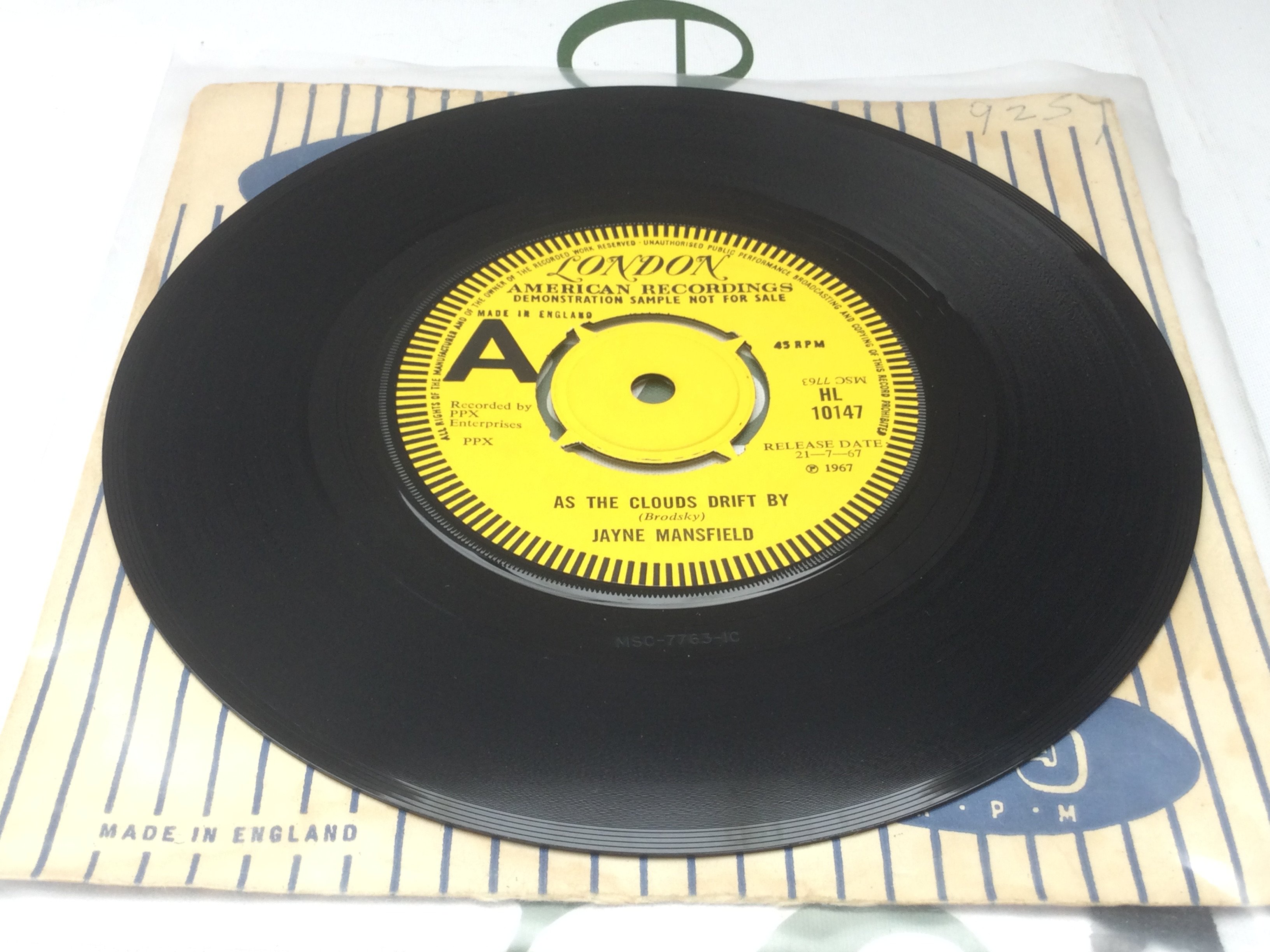 A very rare 7" demo disc by Jayne Mansfield featuring Jimi Hendrix of As The Clouds Drift By b/w Suey. Condition Ex.