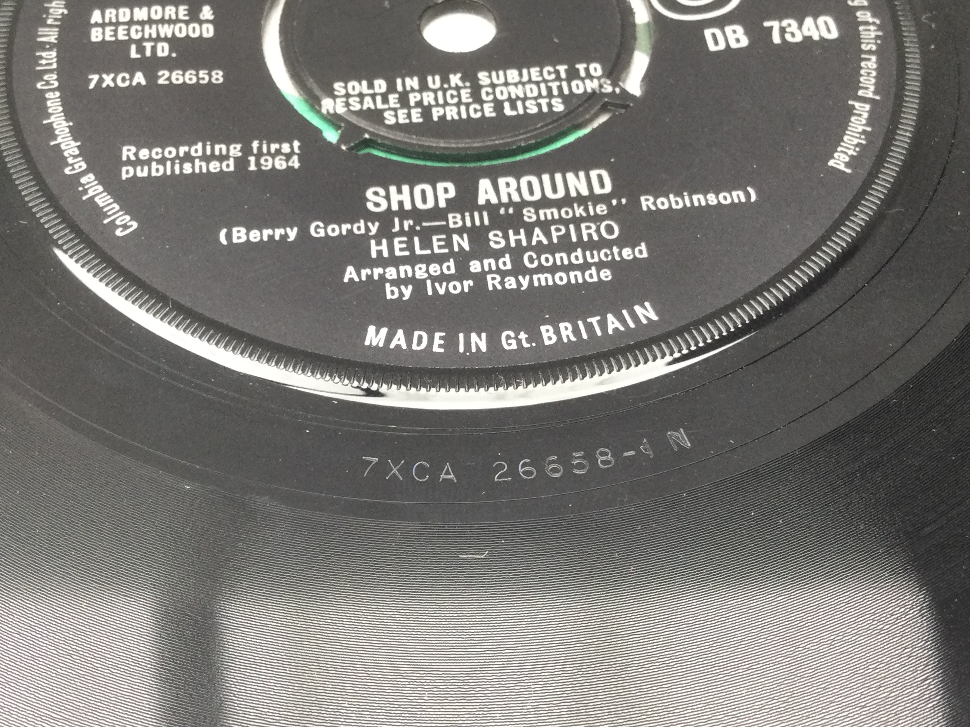 A rare Helen Shapiro 7" single Shop Around b/w He Knows How To Love Me. Condition Ex.