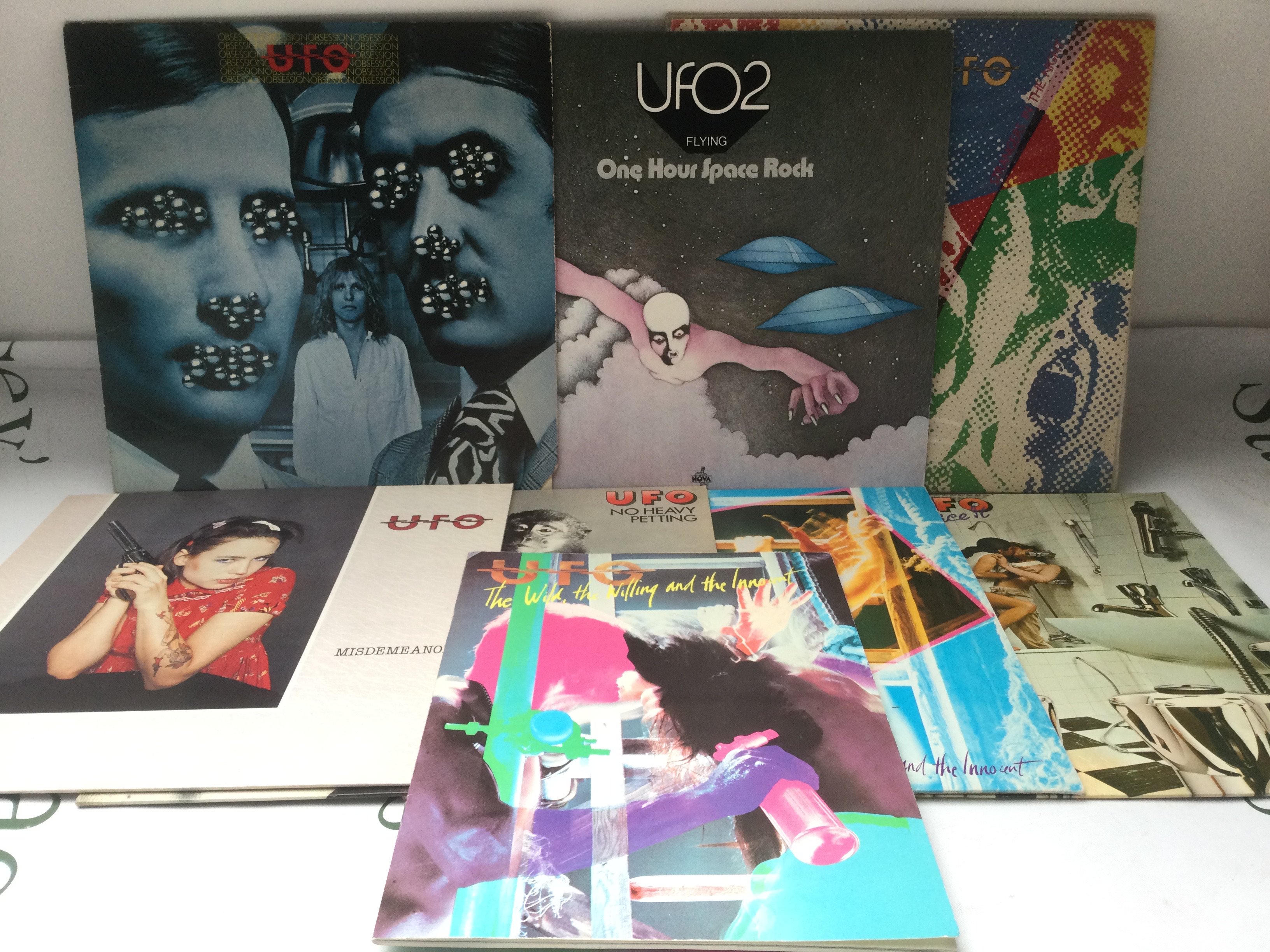 Fifteen UFO and related LPs comprising Strangers In The Night, One Hour Space Rock and others plus a guitar player's songbook.