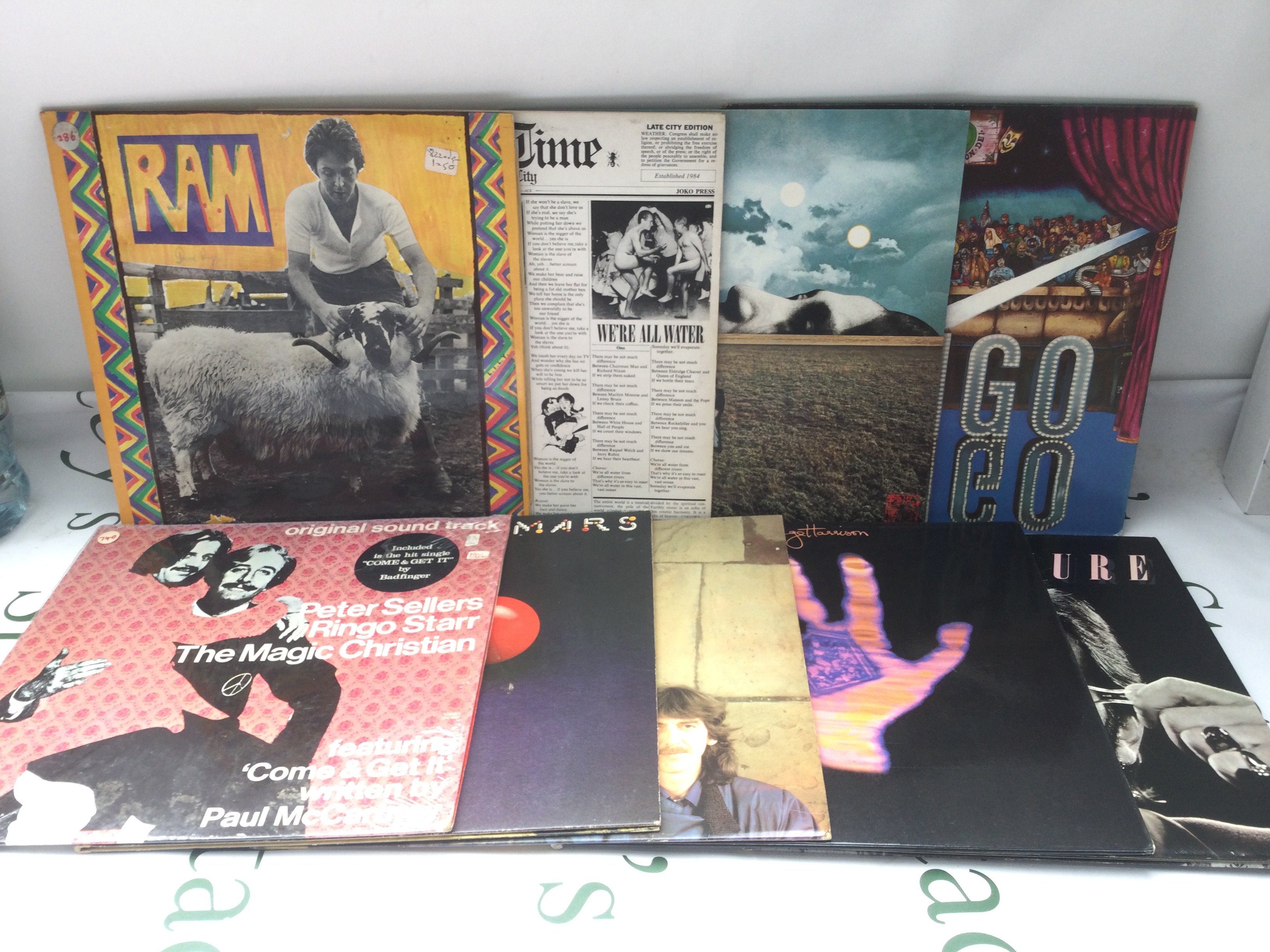 Two bags containing 18 solo Beatles and related LPs comprising Ram, Living In The Material World, Mind Games and others.