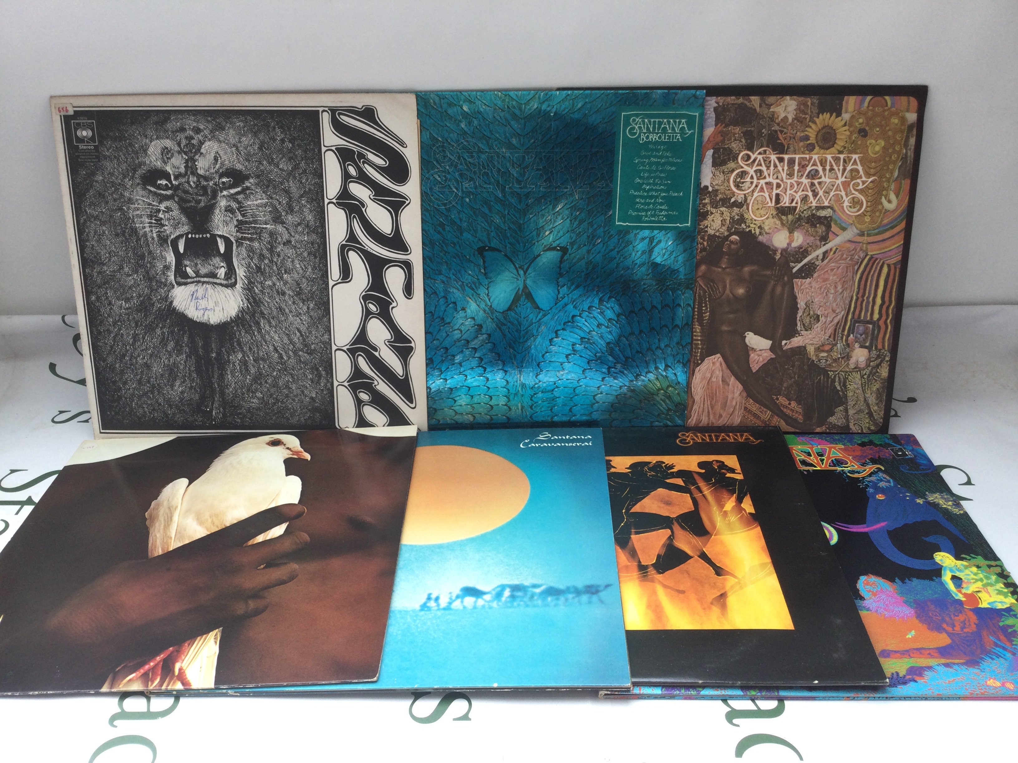 Seven Santana LPs comprising Abraxas, Caravanserai and others.