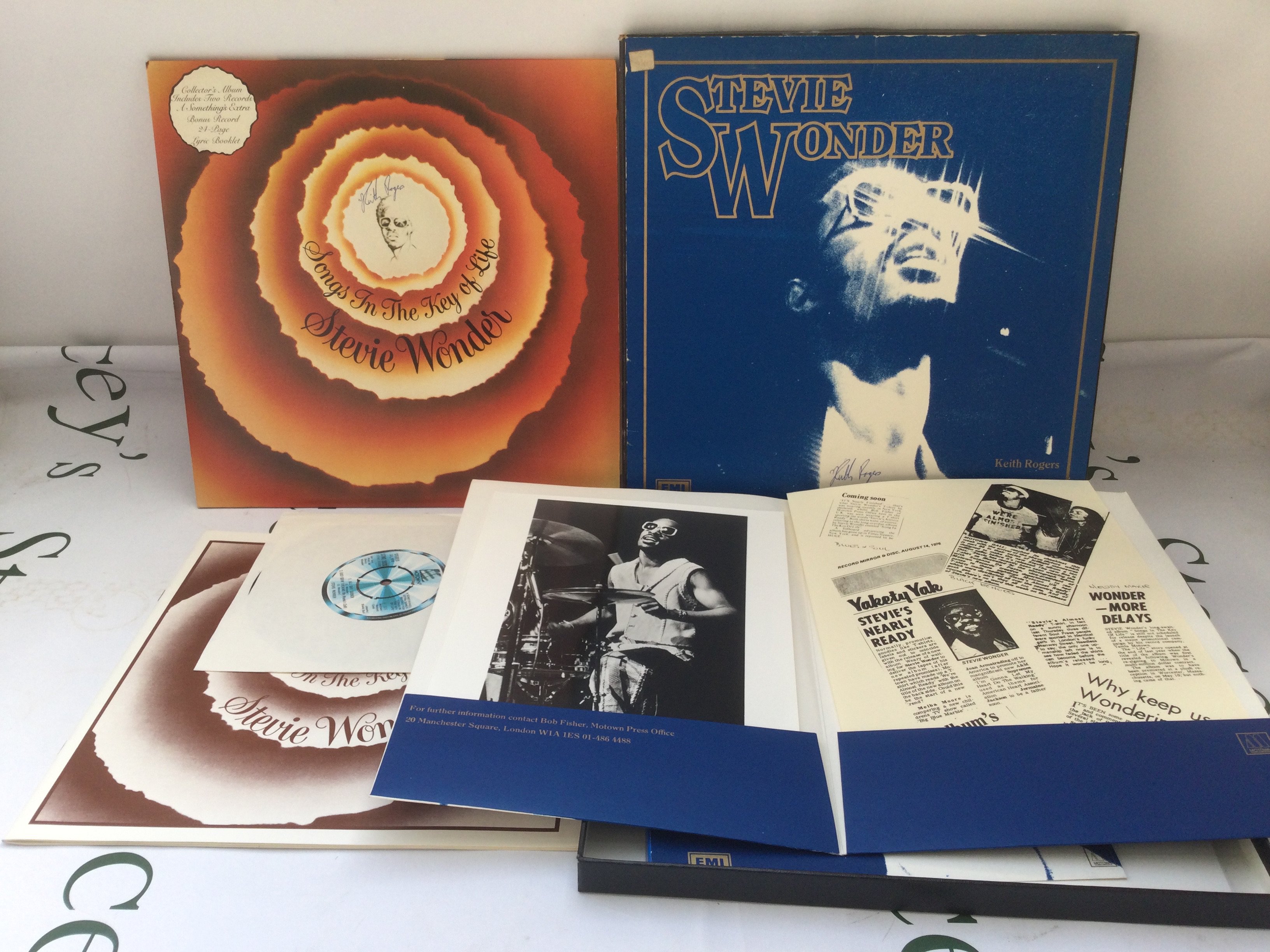 Two bags containing seventeen Stevie Wonder LPs including a Songs In The Key Of Life' press pack, Talking Book, Music Of My Mind and others.