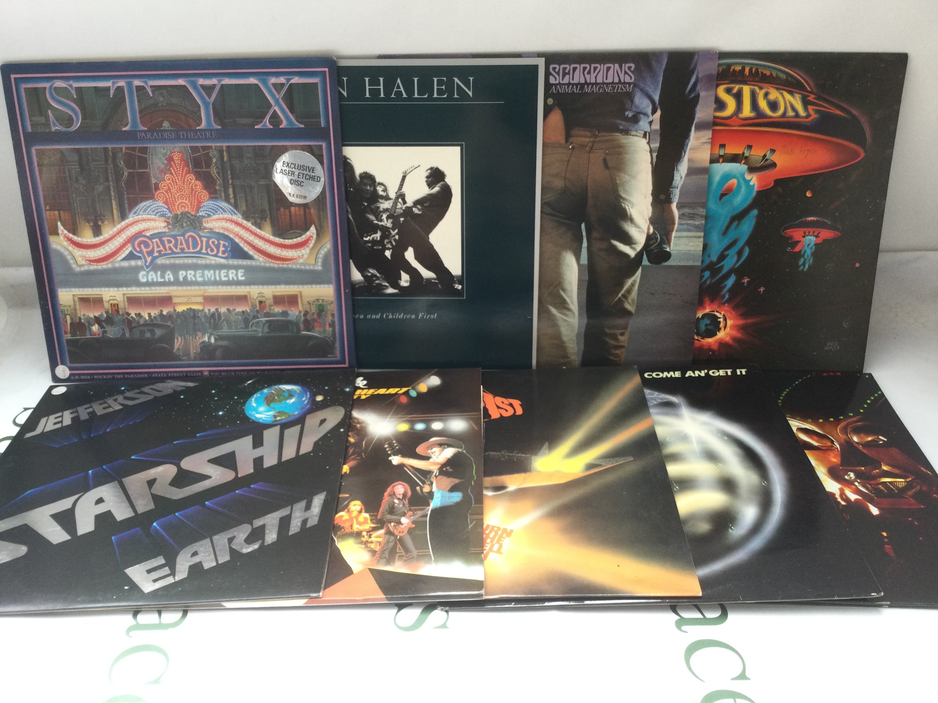 Seventeen rock LPs by various artists including Kiss, Van Halen, Foreigner and others. Includes two promo discs.