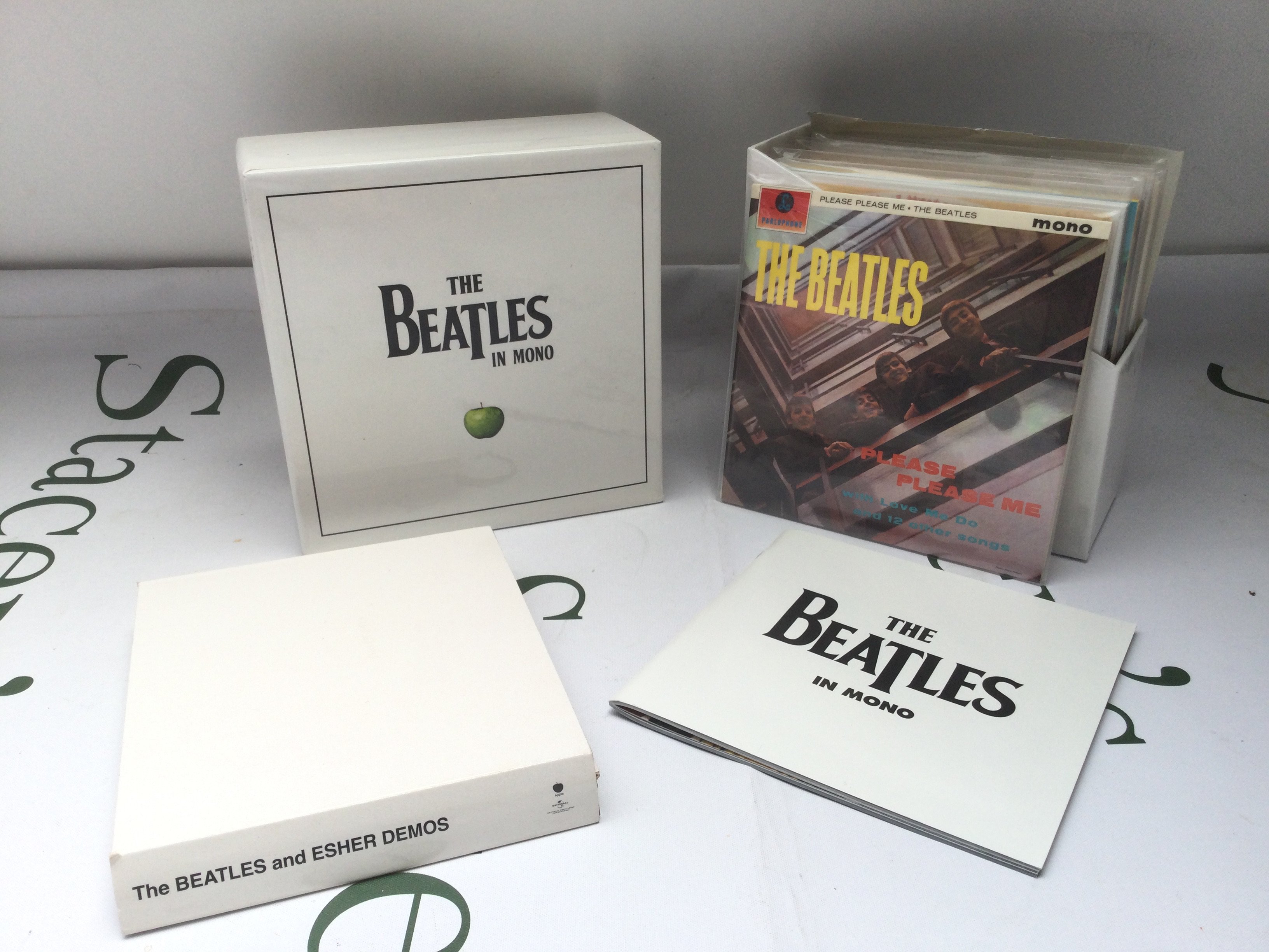 A Beatles In Mono CD box set and a Beatles White Album CD set (2).