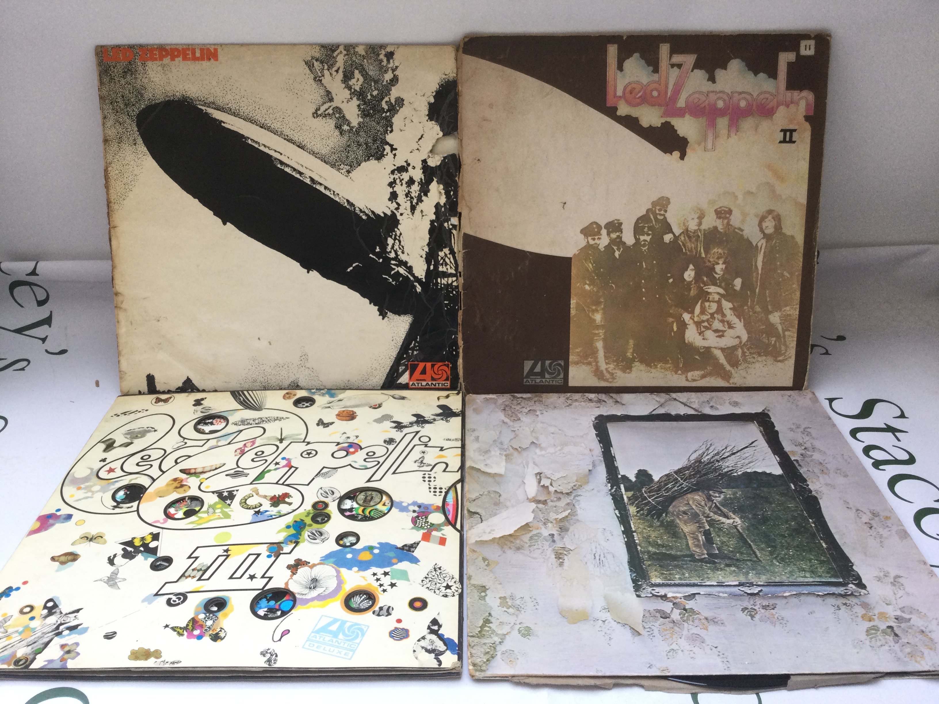 The first four Led Zeppelin LPs on red/plum Atlantic labels. All have outer cover and inner sleeve issues. Led Zeppelin 1, 2 & 3 all have a feelable scratch on Side A.