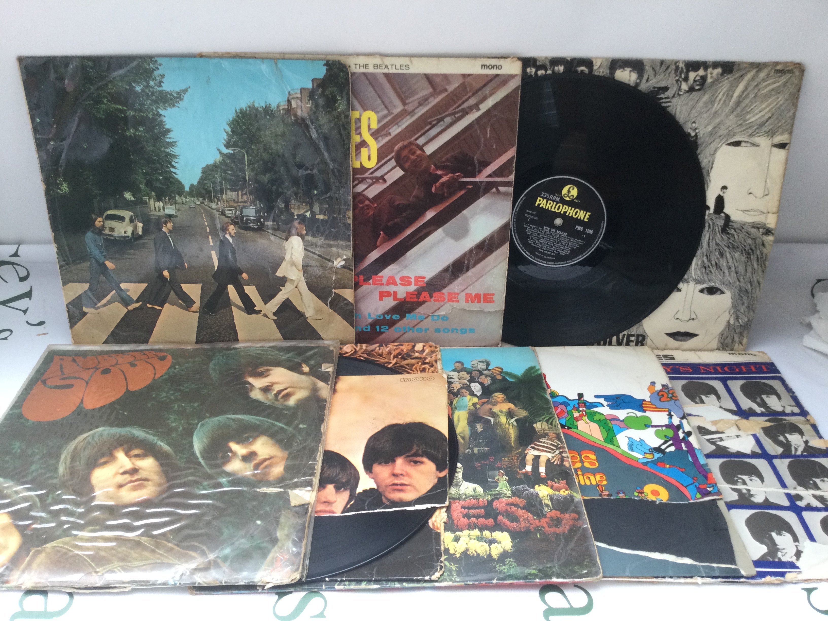 Nine Beatles LPs comprising Abbey Road, Revolver and others. Some poor condition sleeves. Some scratches to vinyl.